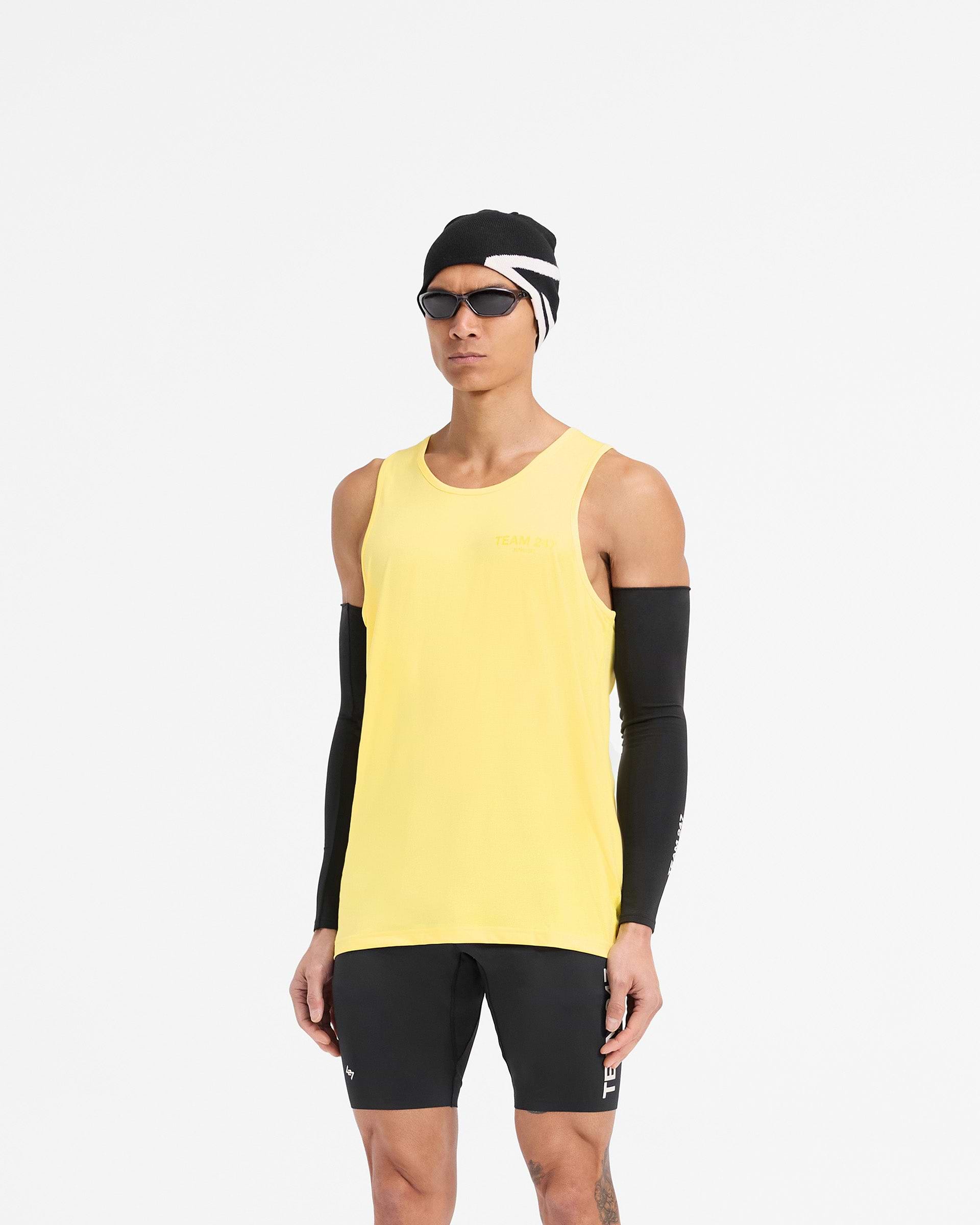 Man wearing a yellow running vest on a plain white background | Team 247 Run Vest in Lemon | Lightweight breathable running vest | 247 T-Shirts | Represent Clo