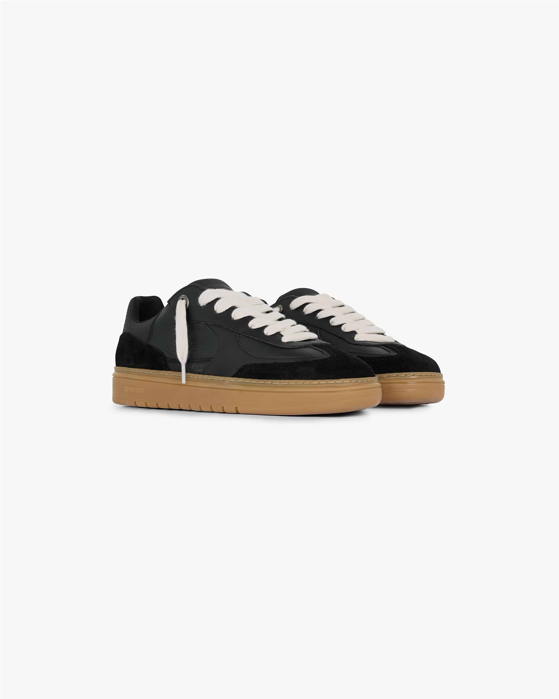 Back product image of mens black sneaker with gum sole on a plain white background | Virtus in Black Gum | Low profile sneaker with tri-leather and suede upper | FW24 Footwear | Represent Clo
