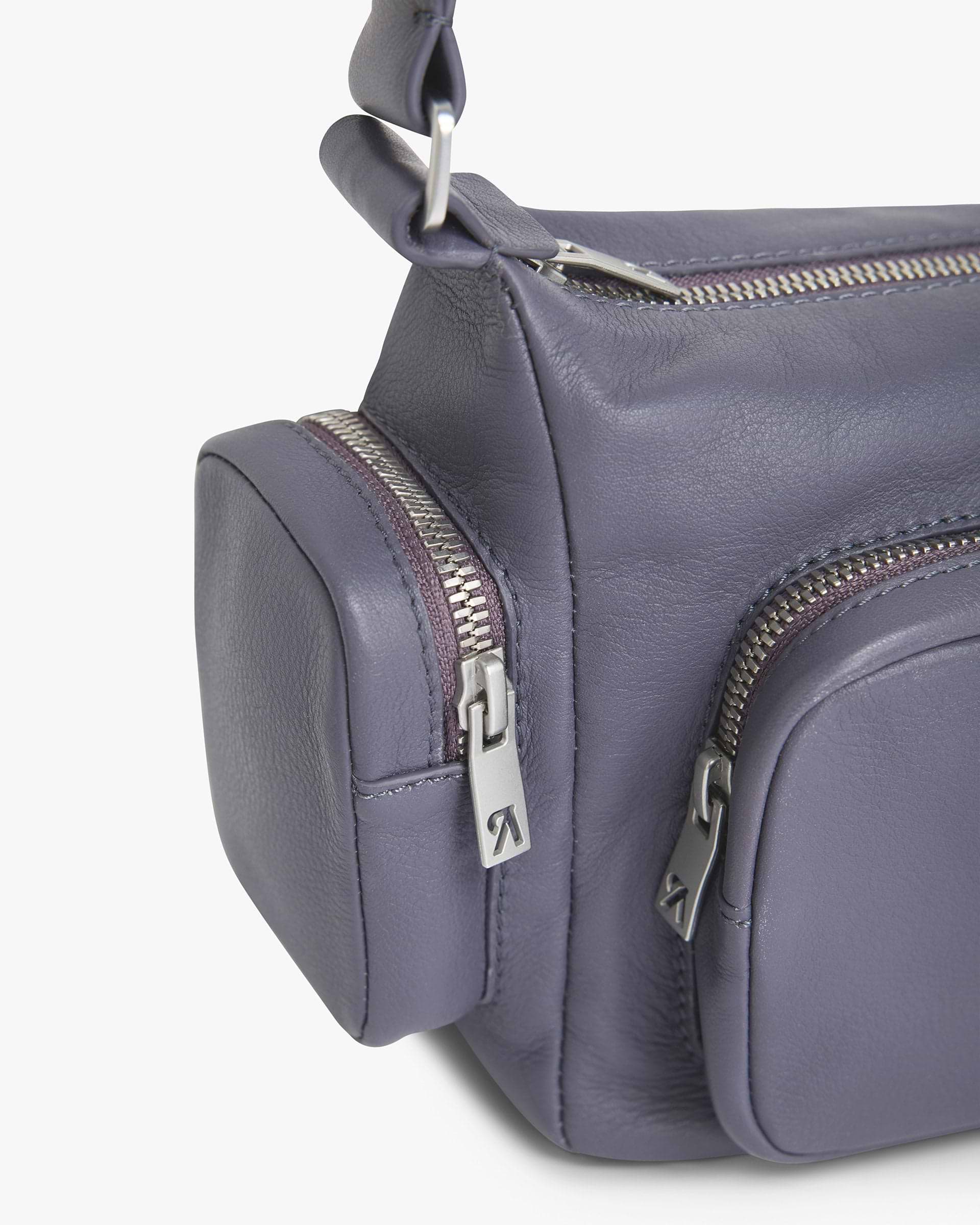 Back product image of a womens grey leather shoulder bag on a plain white background | Utility Shoulder Bag in Excalibur | Leather bag with zip fastening and shoulder strap | Womens SS25 Accessories | Represent Clo