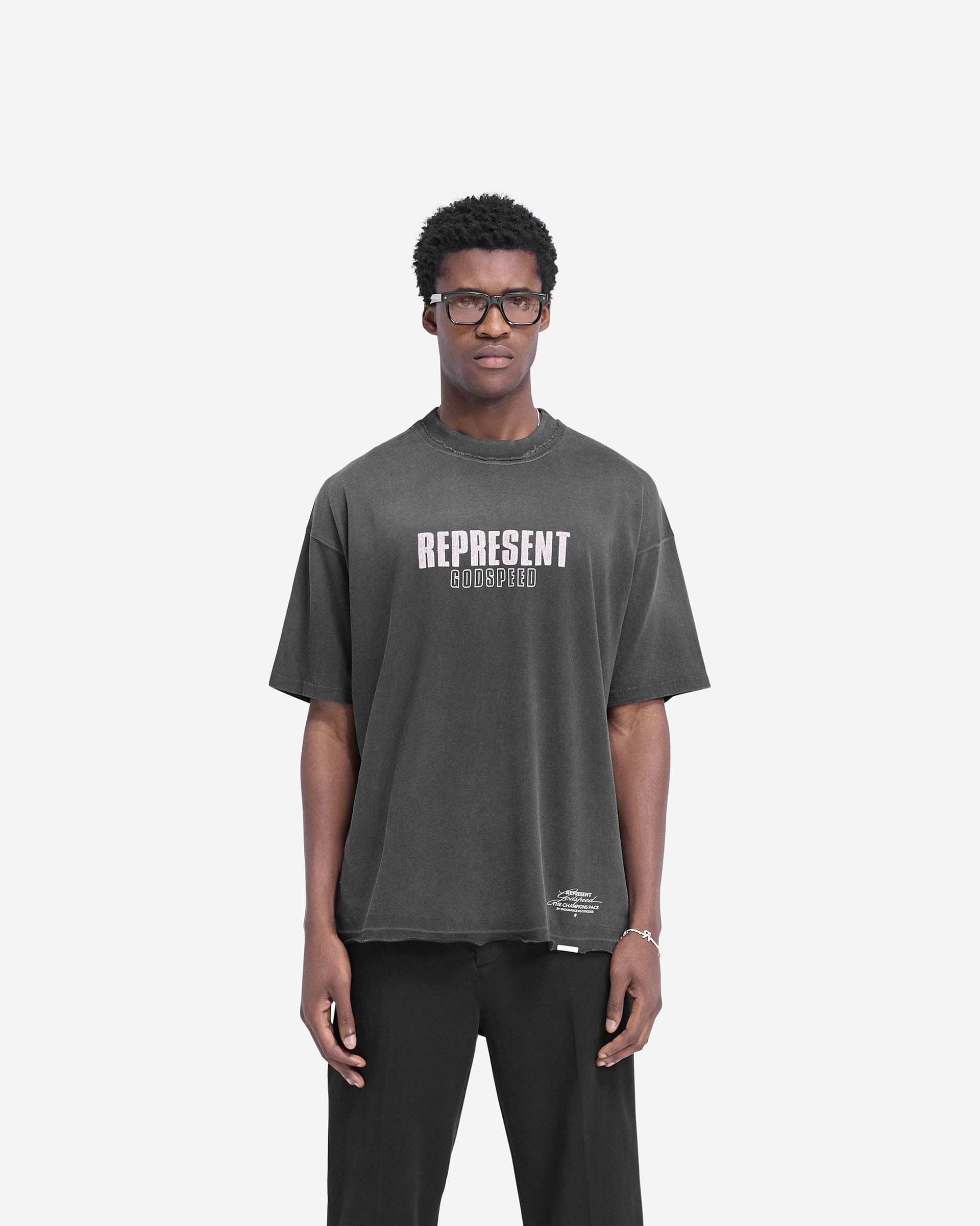Man wearing an aged black t-shirt on a plain white background | Godspeed T-Shirt in Aged Black | Oversized t-shirt with cracked graphic and raw hem | FW24 T-Shirts | Represent Clo