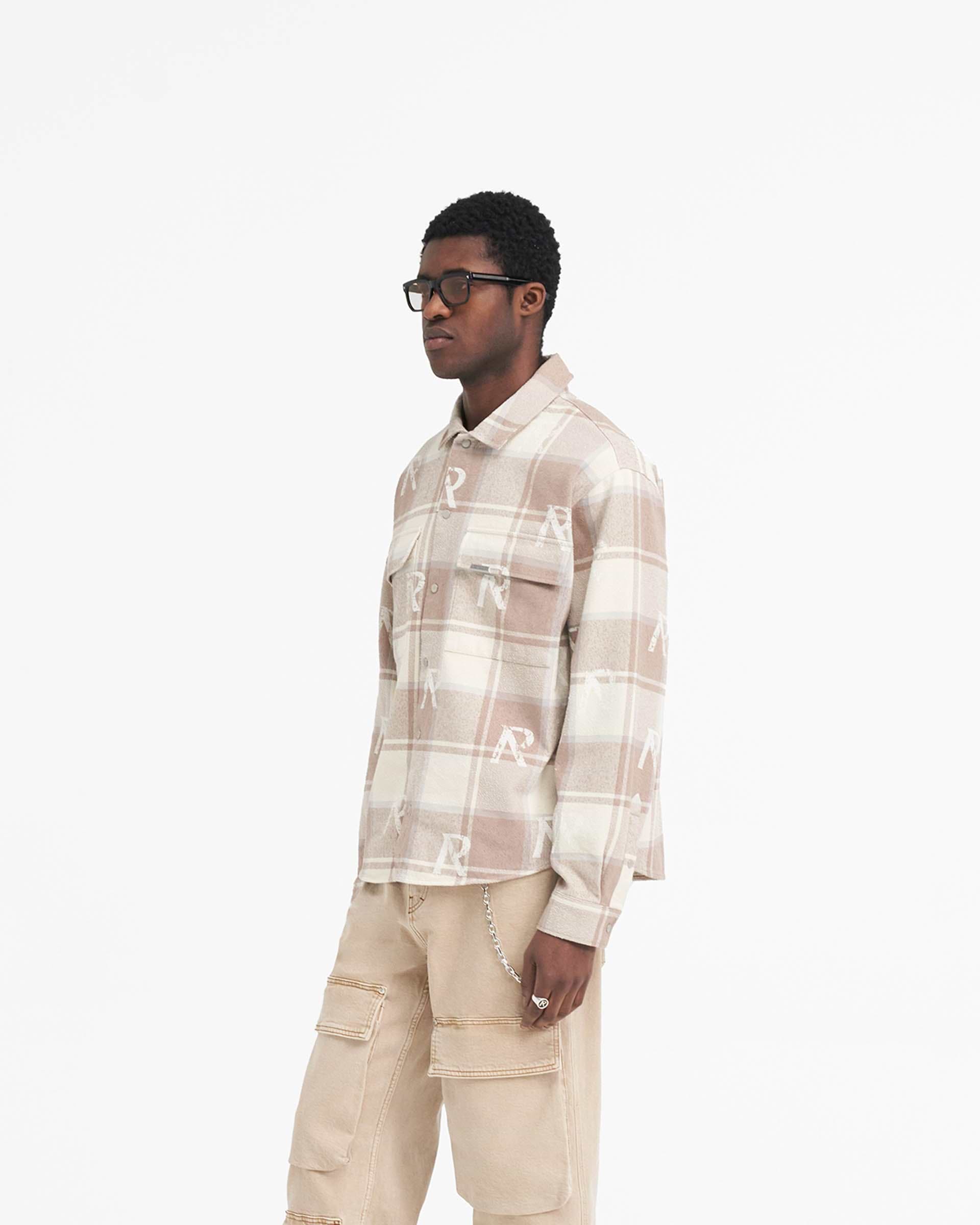Back product image of a mens brown check shirt on a plain white background | All Over Initial Flannel Shirt in Cashmere | Flannel shirt with distressed initial logos and Cobrax popper fastenings | SS24 Shirts | Represent Clo