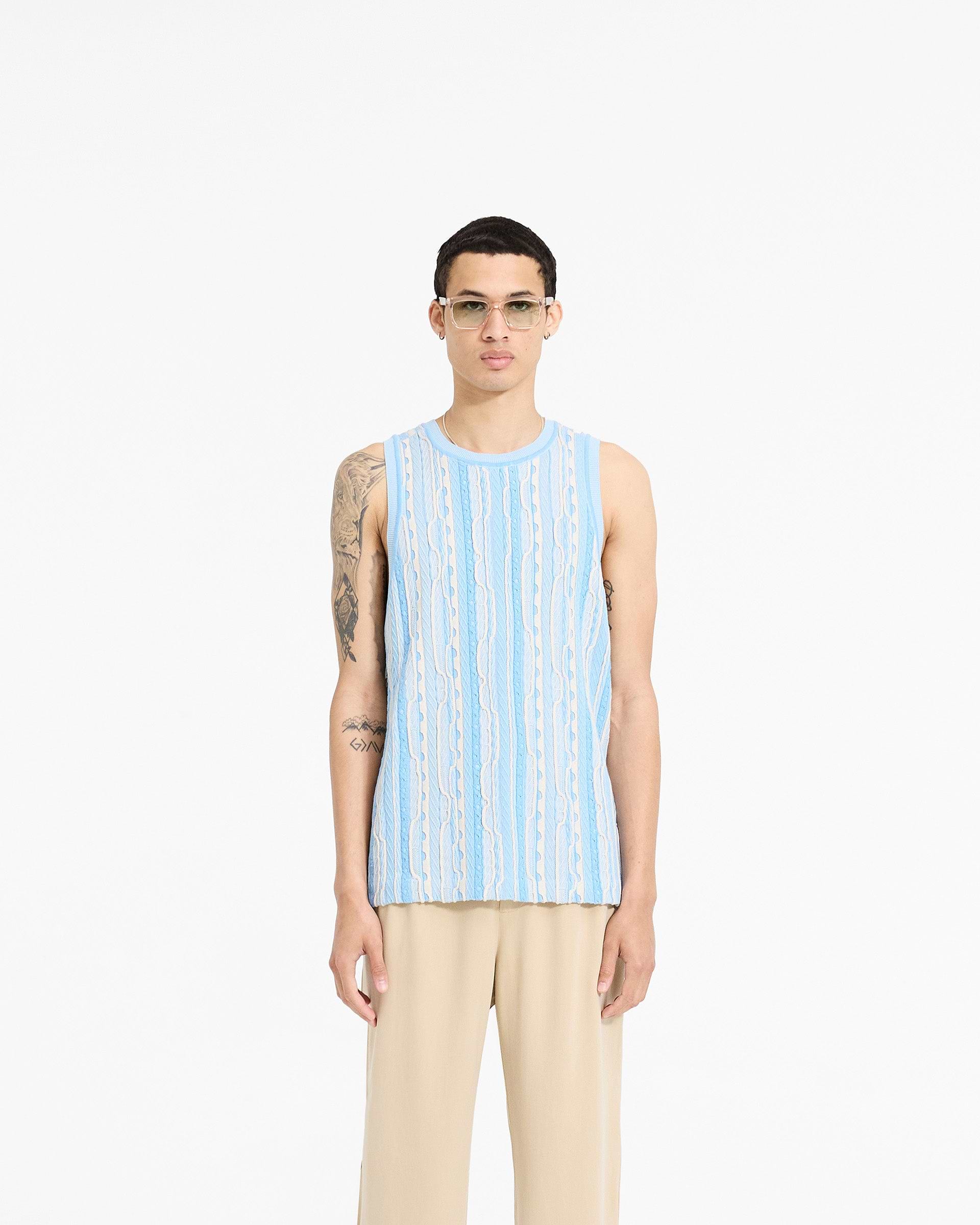 Man wearing a blue knit vest on a plain white background | Mixed Knit Vest in Royal Blue | Regular fit knit vest with round neck | SC24 Knitwear | Represent Clo