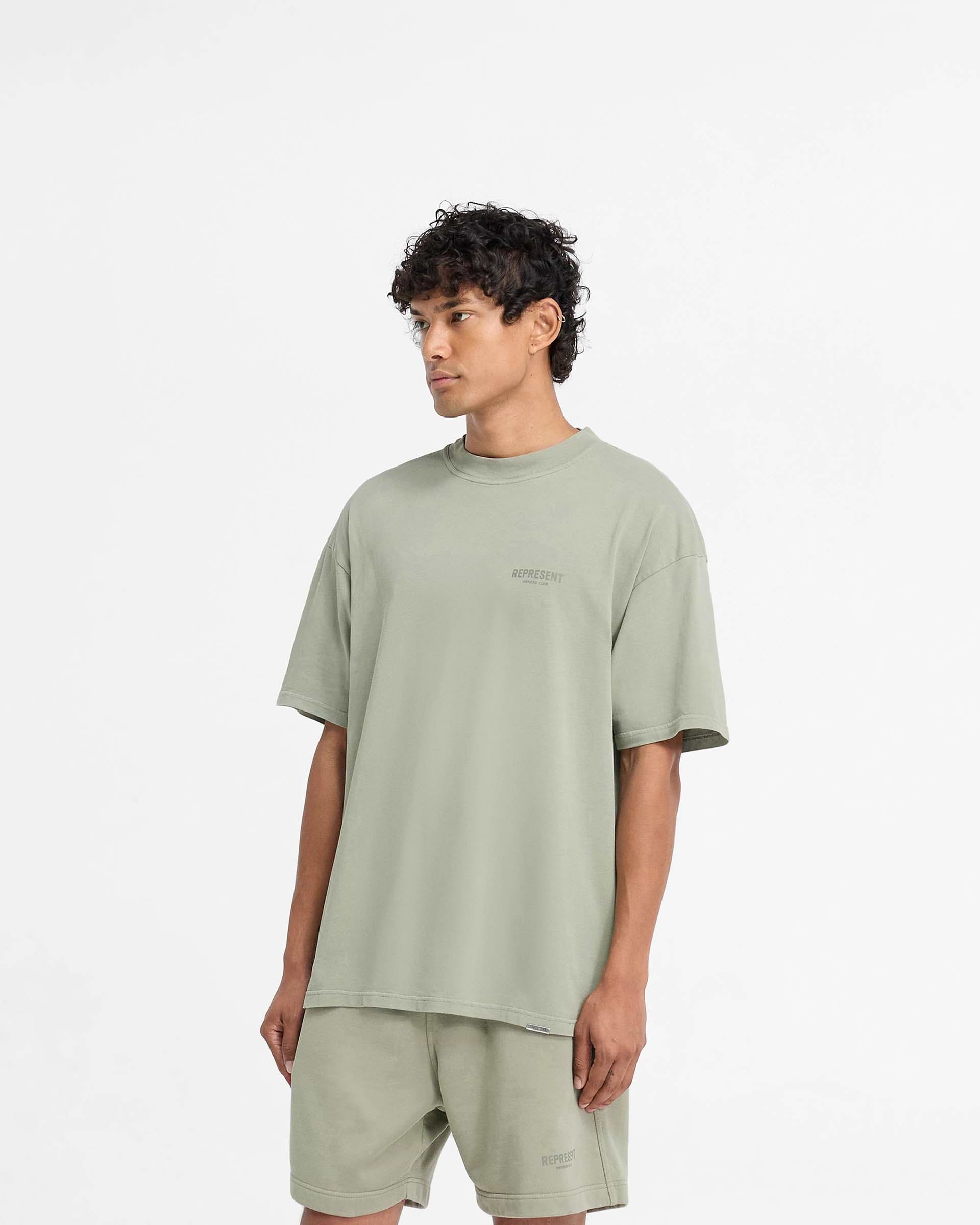 Man wearing a pastel green t-shirt on a plain white background | Represent Owners Club T-Shirt in Pastel Green | Oversized short sleeve jersey tee | Owners Club T-Shirts | Represent Clo