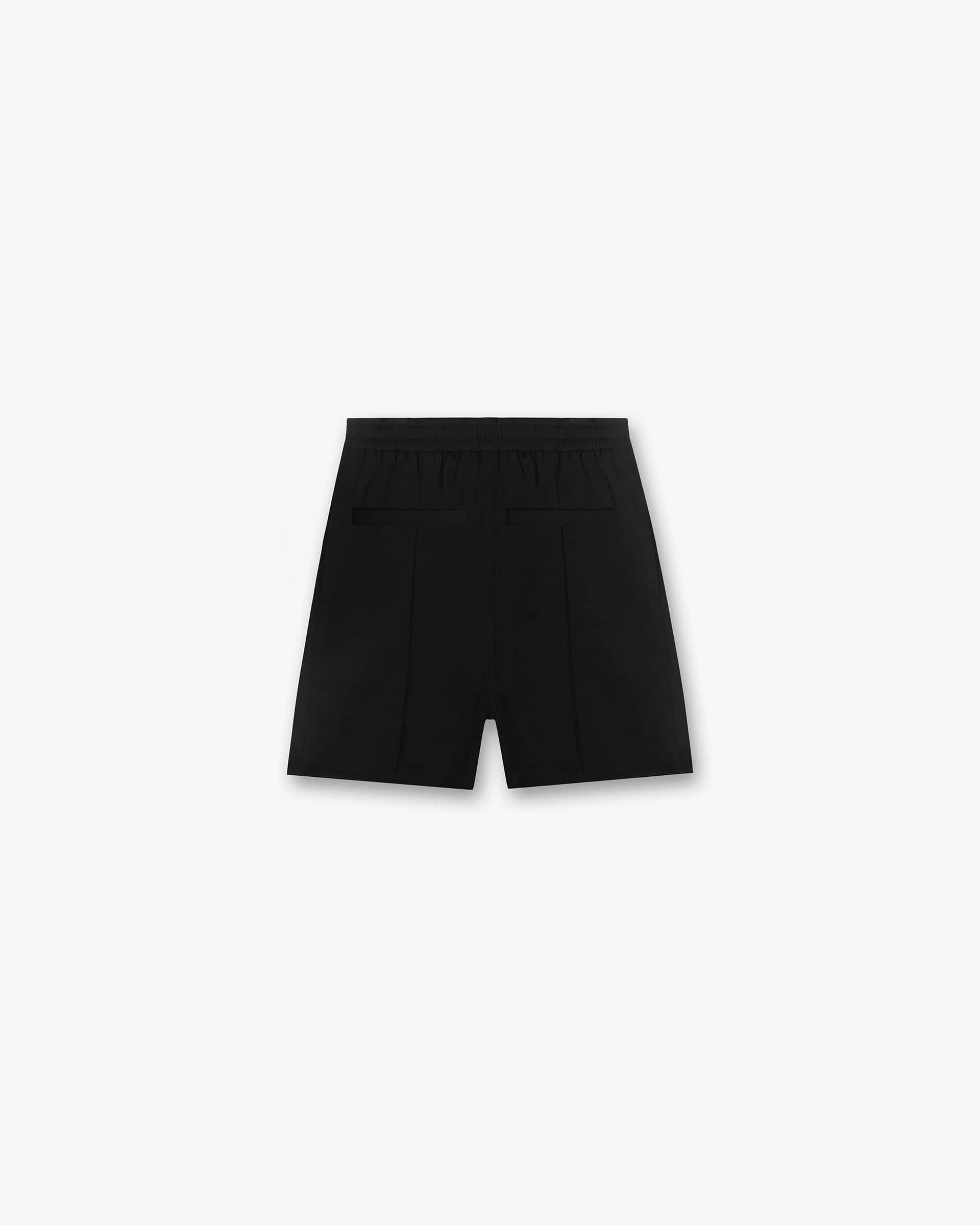 Back product image of mens black shorts on a plain white background | Initial Track Short in Black | Elasticated waistband track shorts | Initial Shorts | Represent Clo