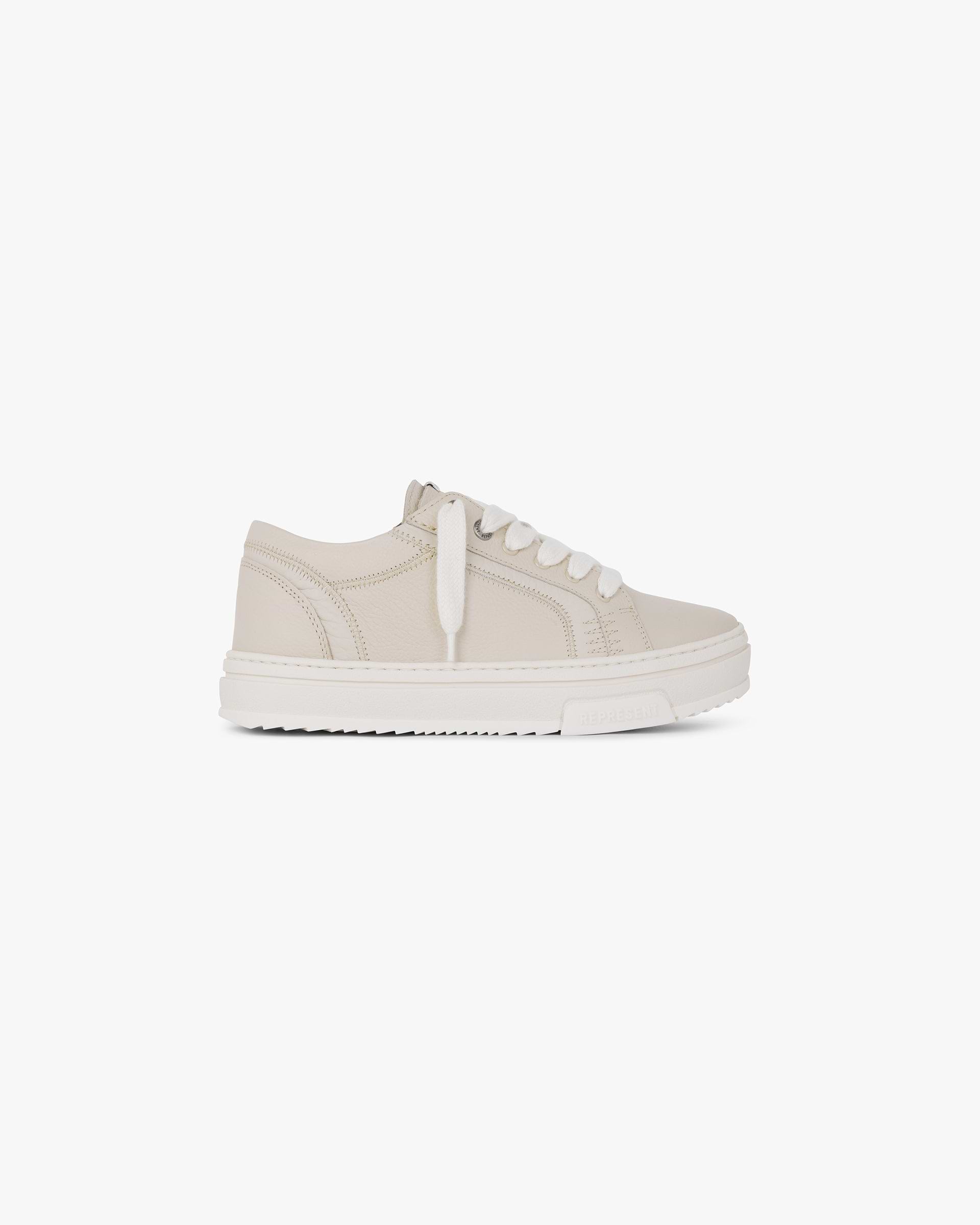 Front product image of a mens sand shoe on a plain white background | HTN Tumble Mix in Sand | Cream shoe with screen printed graphic | FW24 Footwear | Represent Clo