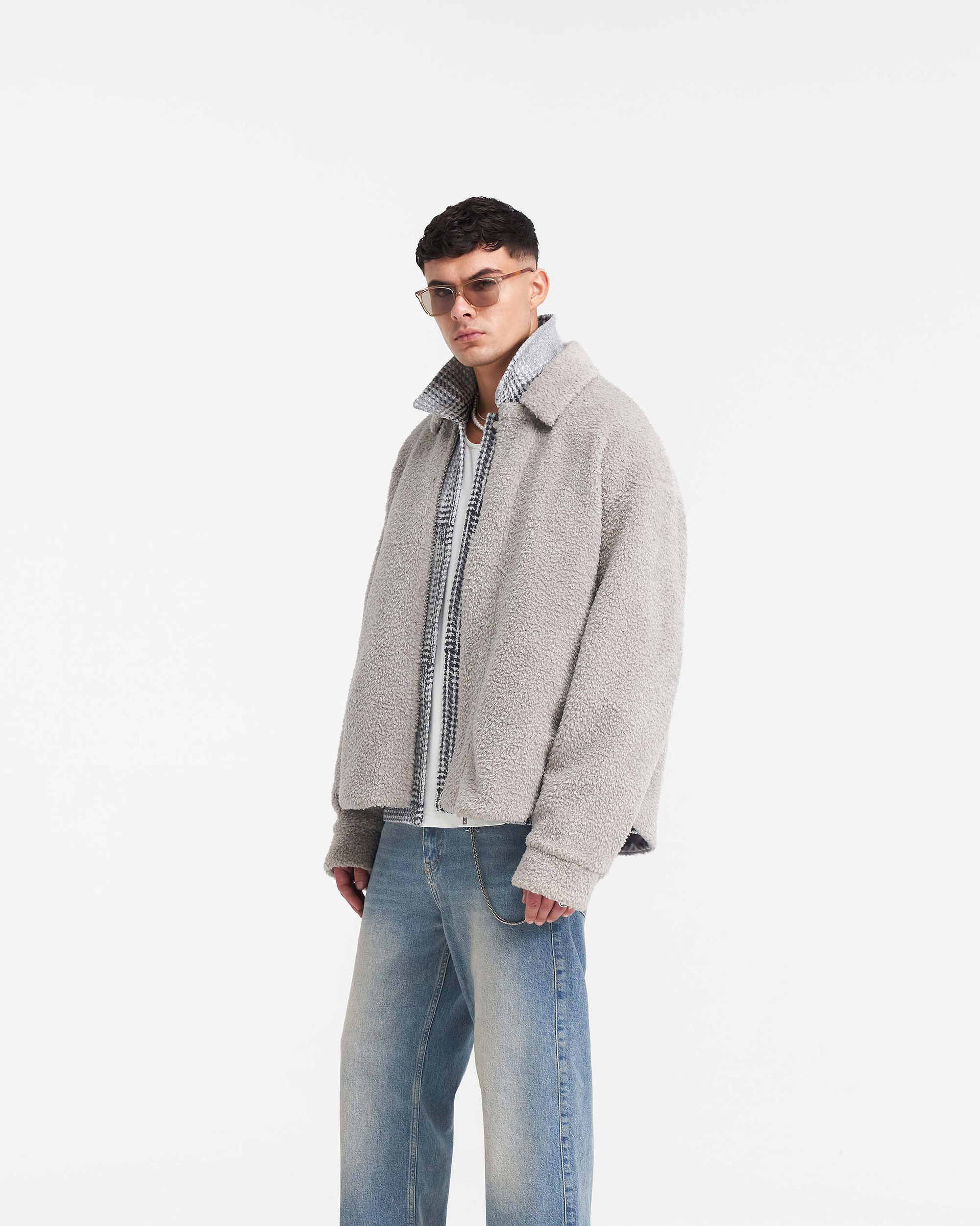 Back product image of a mens grey shearling shirt on a plain white background | Shearling Scoop Hem Shirt in Ice Grey | Shearling shirt with welt pockets and curved dip hem | PRE SS24 Shirts | Represent Clo