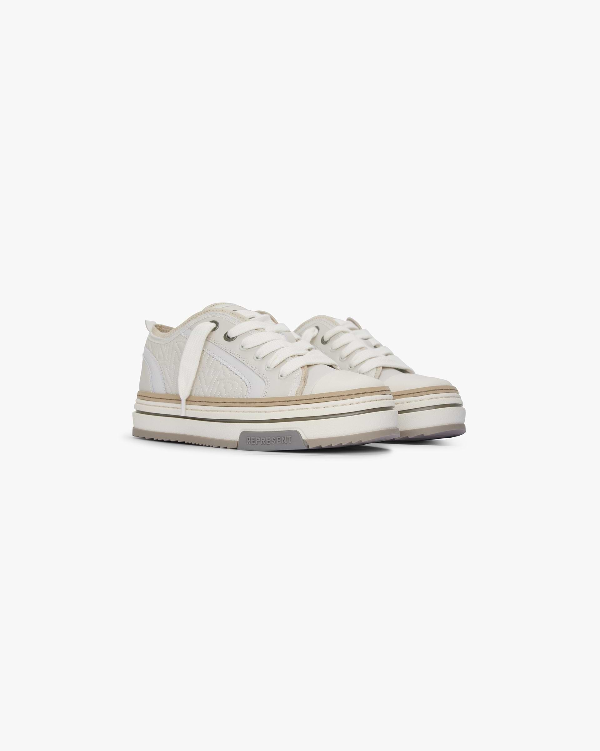 Back product image of a mens white sneaker on a plain white background | HTN X Low in Vintage White | Leather sneakers with embroidered detailing and chunky lacing | SS24 Footwear | Represent Clo