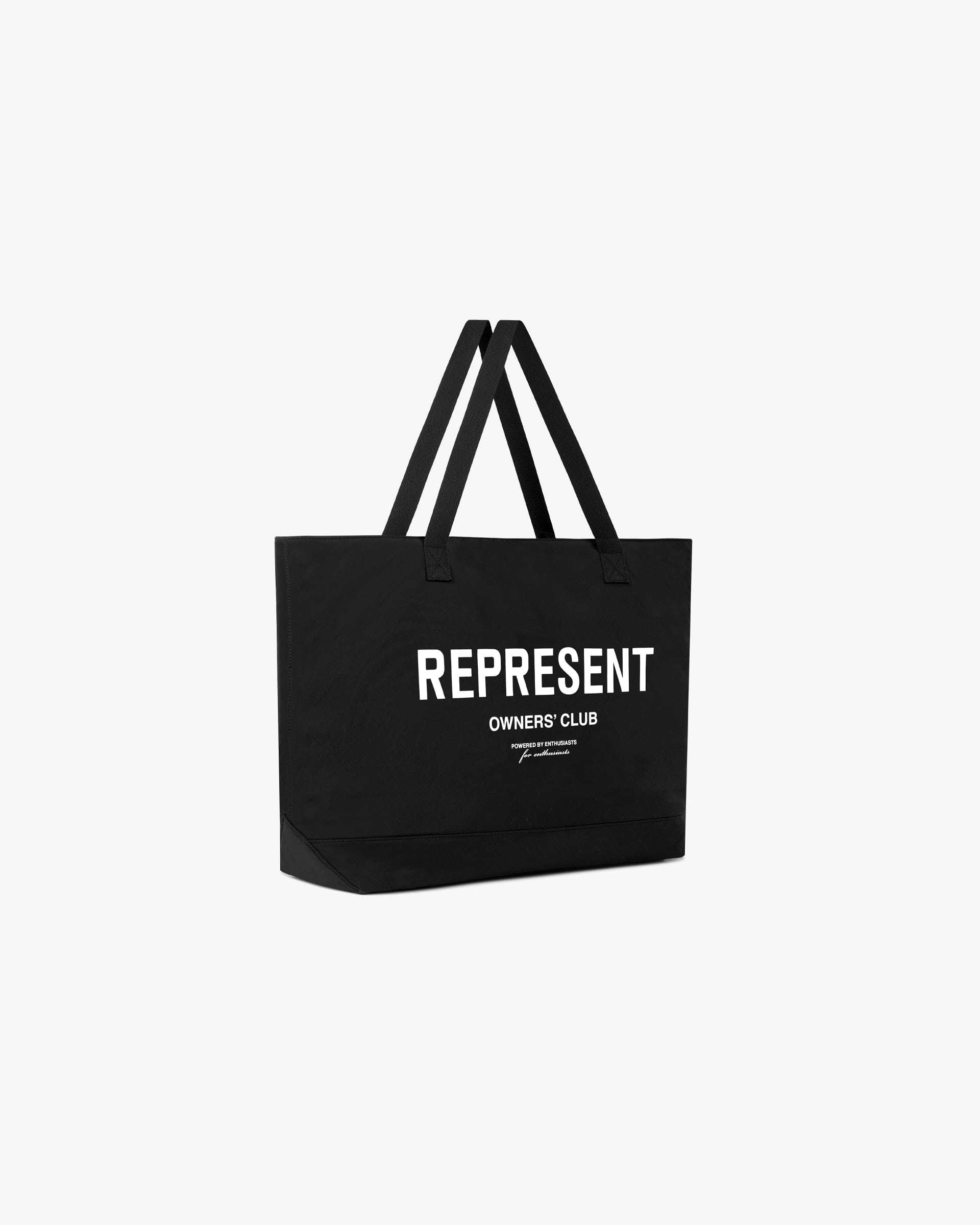 Back product image of a mens black tote bag on a plain white background | Represent Owners Club Woven Tote Bag in Black | Tote bag with 2 carry handles and magnetic closure | Owners Club Accessories | Represent Clo