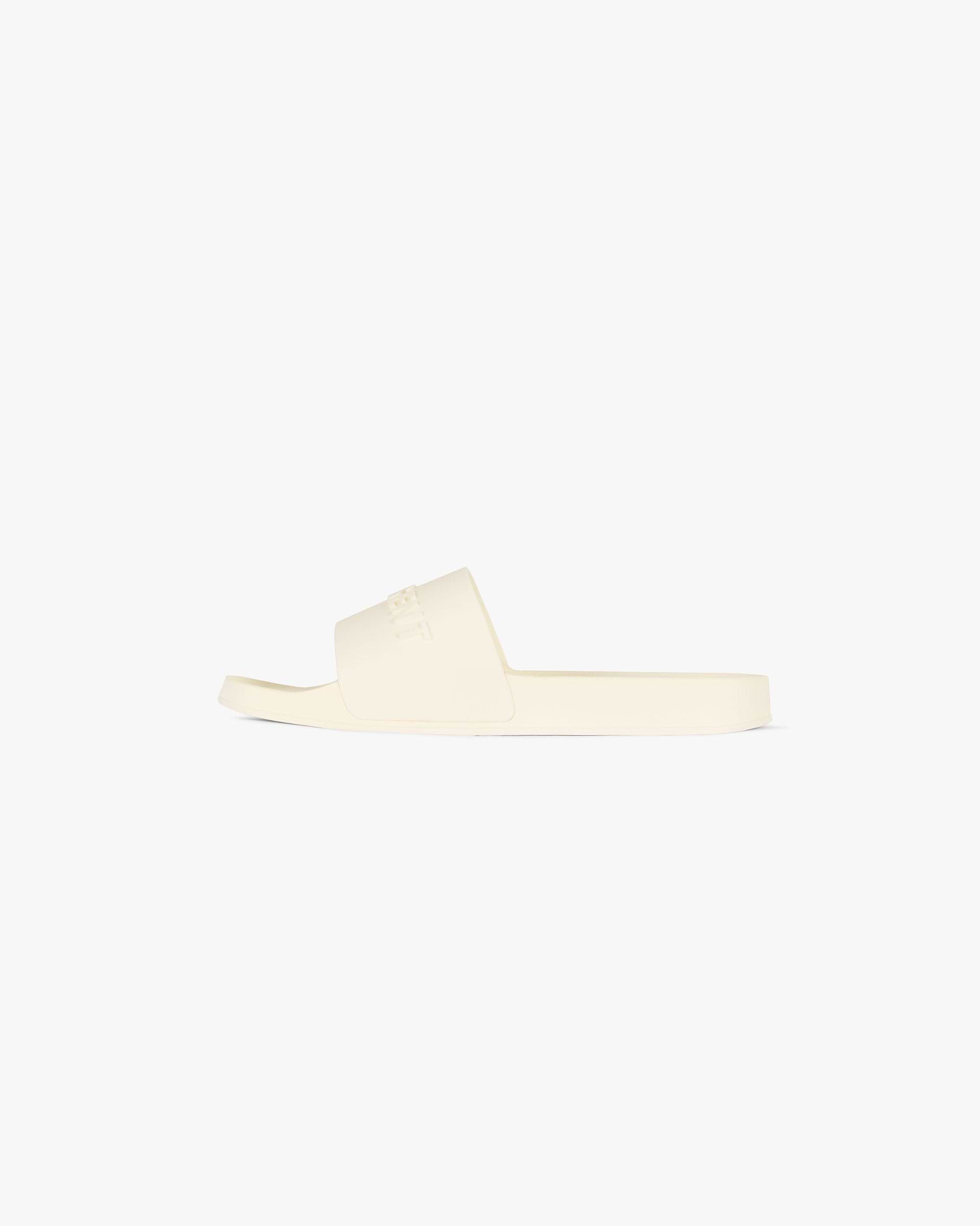 Back product image of mens white slides on a plain white background | Represent Pool Slide in Flat White | Slides with raised logo and soft footbed | FW24 Footwear | Represent Clo