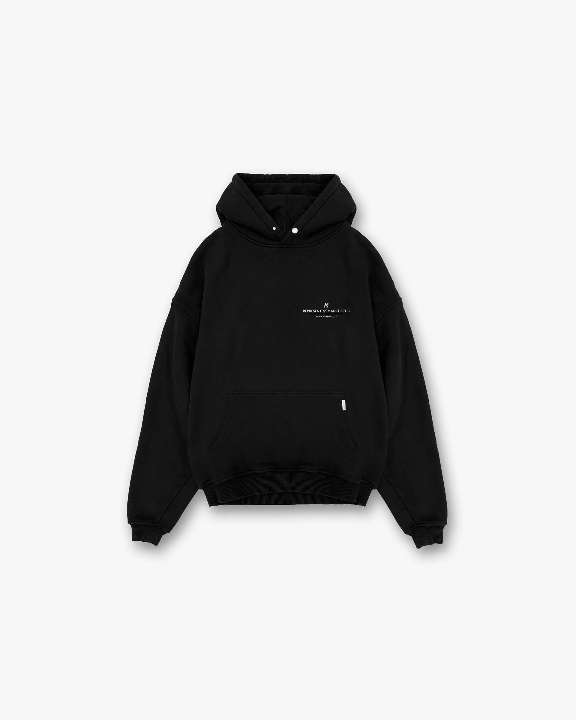 Front product image of a mens black hoodie on a plain white background | Manchester Store Hoodie in Black | Slightly oversized hoodie with vintage 247 typography graphics | Exclusives Hoodies | Represent Clo