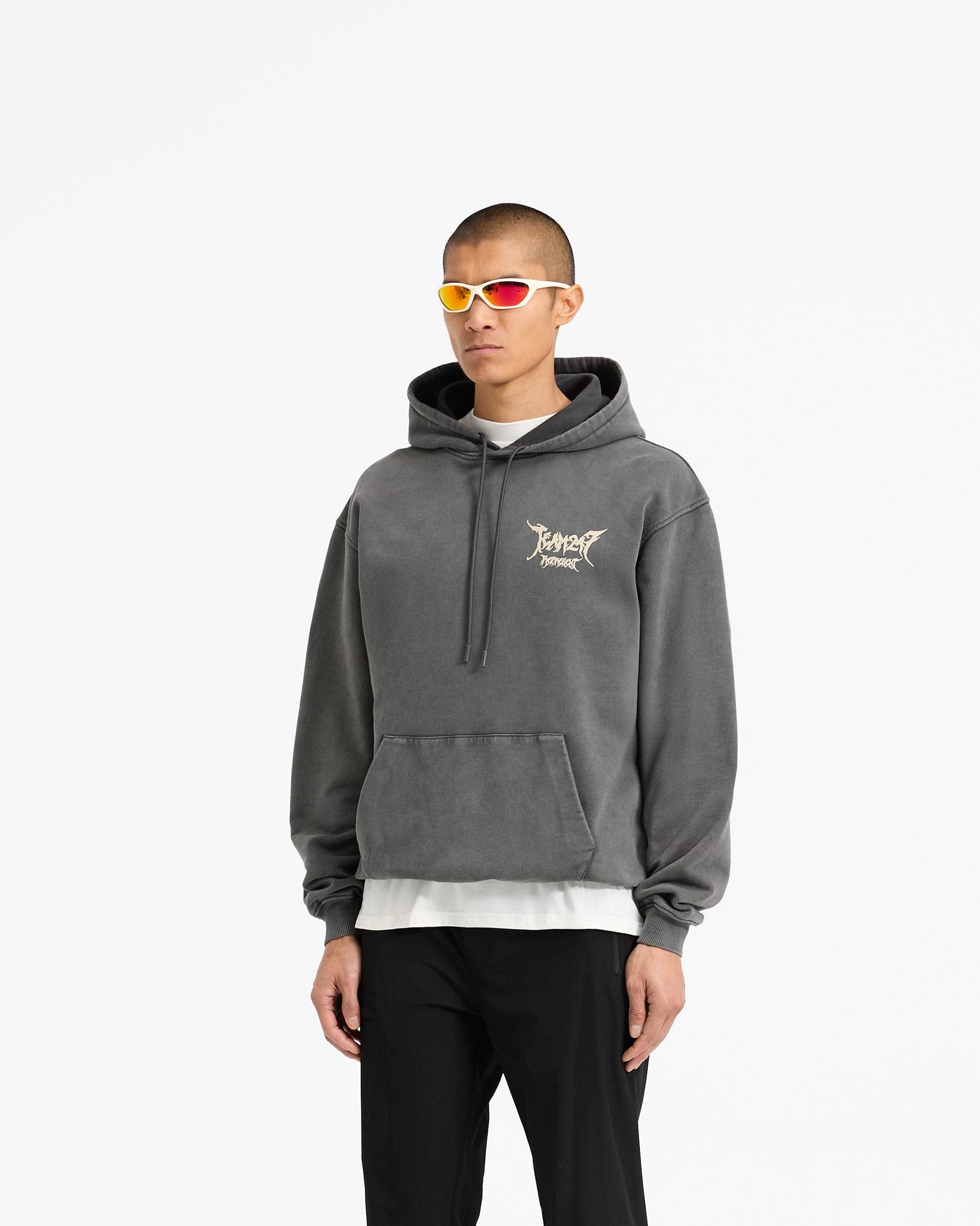Man wearing an oversized grey hoodie on a plain white background | Team 247 X END Oversized Hoodie in Washed Grey | Hoodie with co-branded graphics and ribbed cuffs | 247 Hoodies | Represent Clo