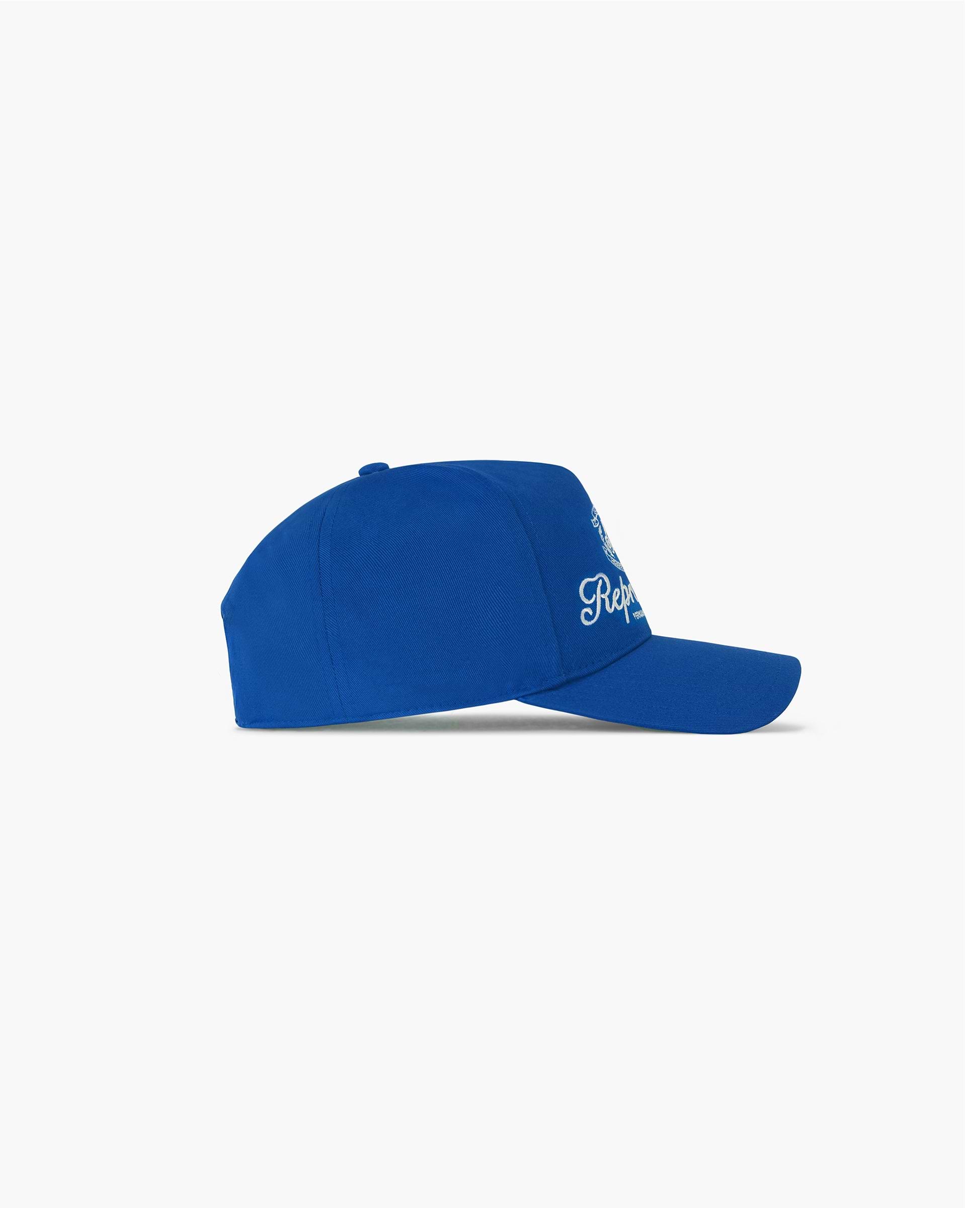 Back product image of a mens blue cap on a plain white background | Permanent Vacation Cap in Royal Blue | Unstructured cap with snapback adjuster | SC24 Accessories | Represent Clo