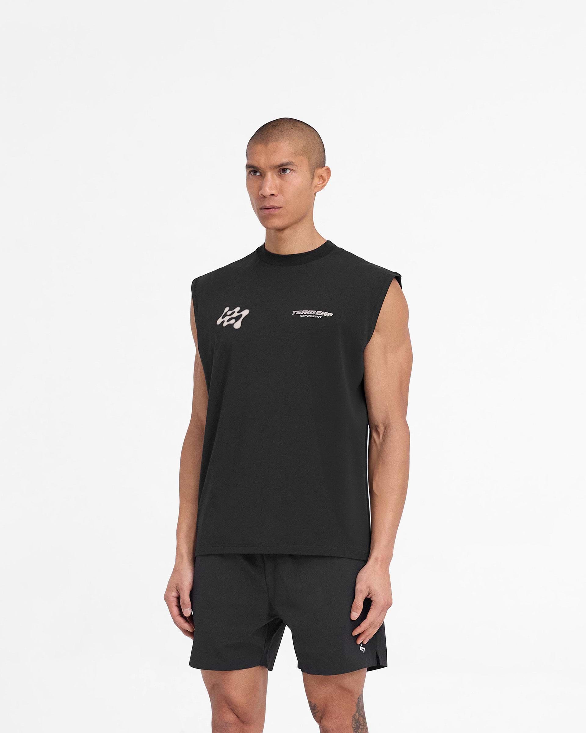Man wearing a black oversized tank on a plain white background | 247 Future Terrains Oversized Tank in Black | Oversized tank with quick drying and breathable Drirelease fabric | 247 T-Shirts | Represent Clo