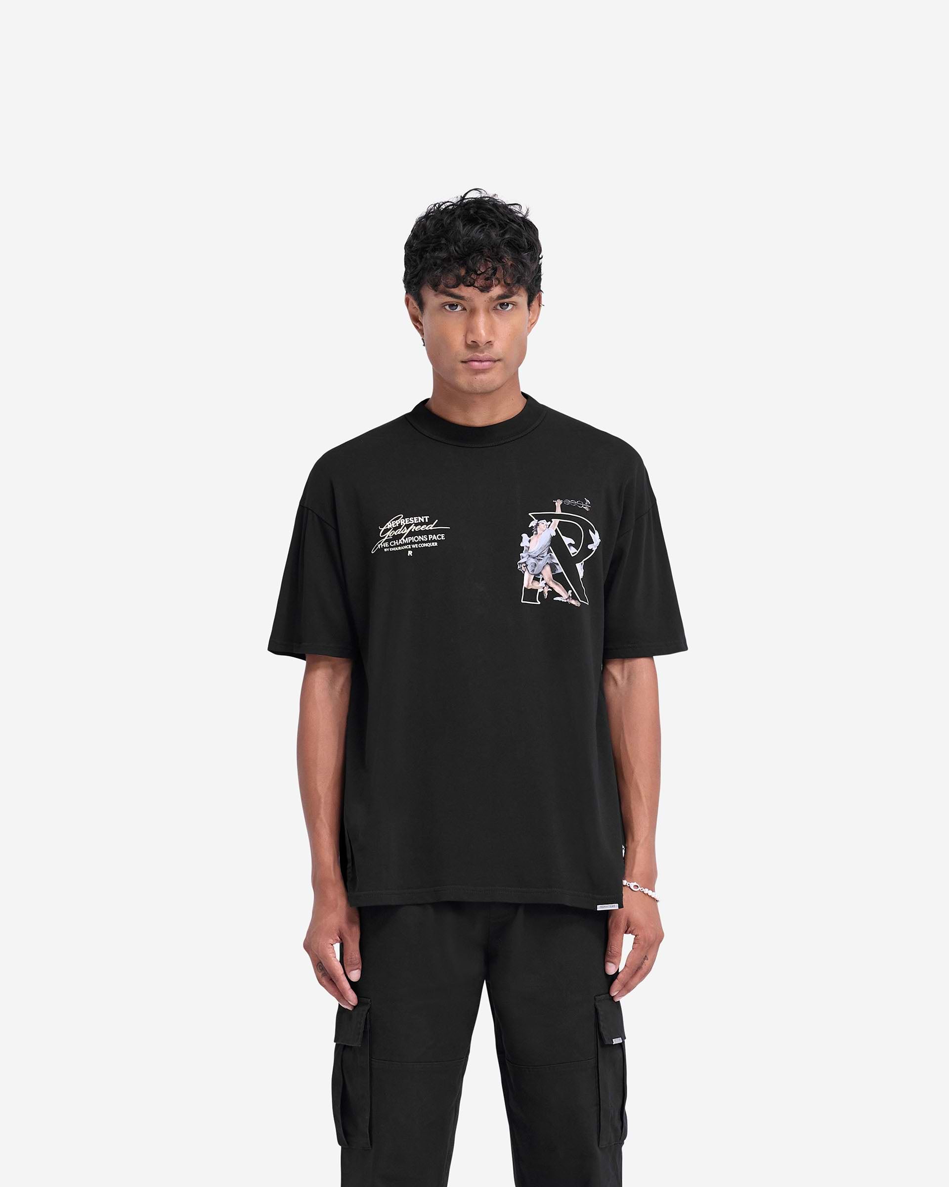 Man wearing a black oversized t-shirt on a plain white background | Hermes T-Shirt in Jet Black | Oversized t-shirt with screen print graphic and metal bar logo | FW24 T-Shirts | Represent Clo