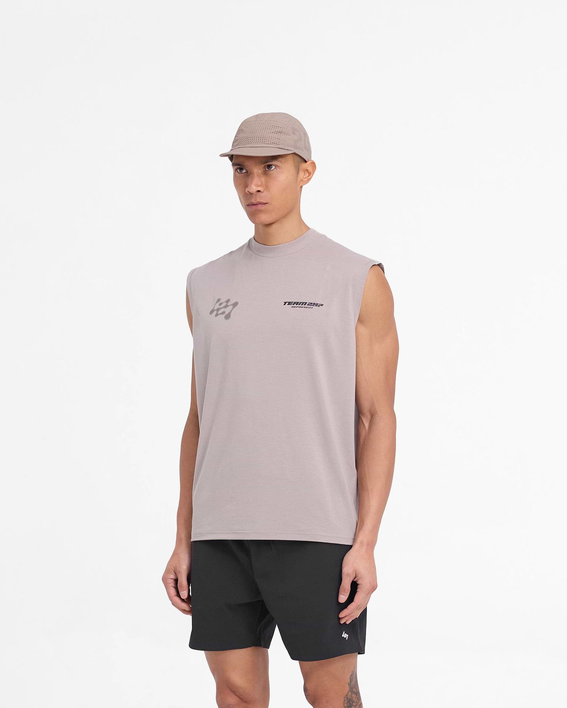 Man wearing a grey oversized tank on a plain white background | 247 Future Terrains Oversized Tank in Moonrock | Quick drying oversized tank with breathable Drirelease fabric | 247 T-Shirts | Represent Clo