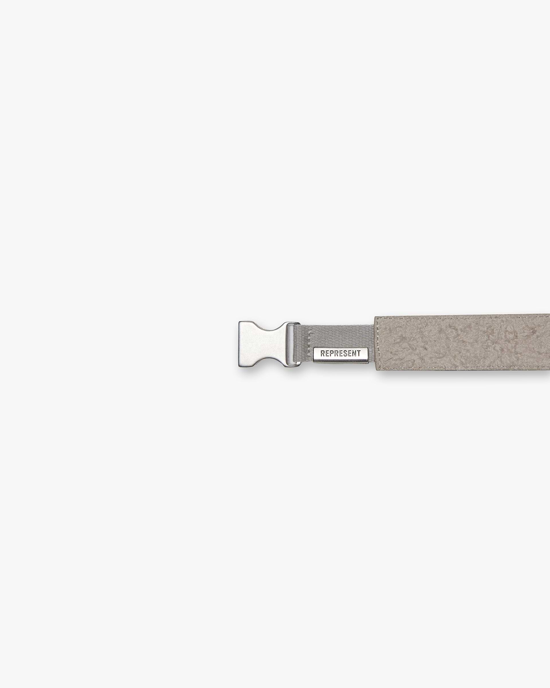 Back product image of a mens cashmere belt on a plain white background | Represent Belt in Cashmere | Hairy suede belt with tumbled leather back and brushed silver buckle | SS24 Accessories | Represent Clo