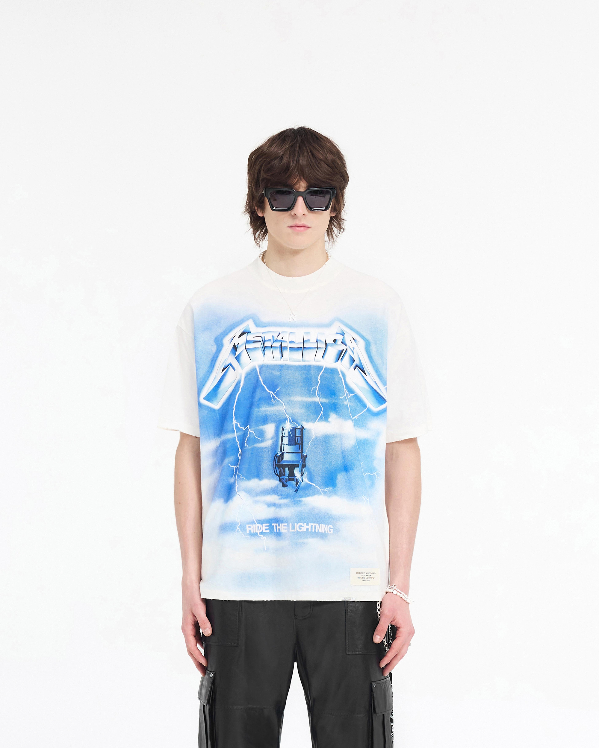 Man wearing a white t-shirt on a plain white background | Represent X Metallica Ride The Lightning T-Shirt in Flat White | Vintage-inspired slub fabric with front and back prints | SS24 T-Shirts | Represent Clo
