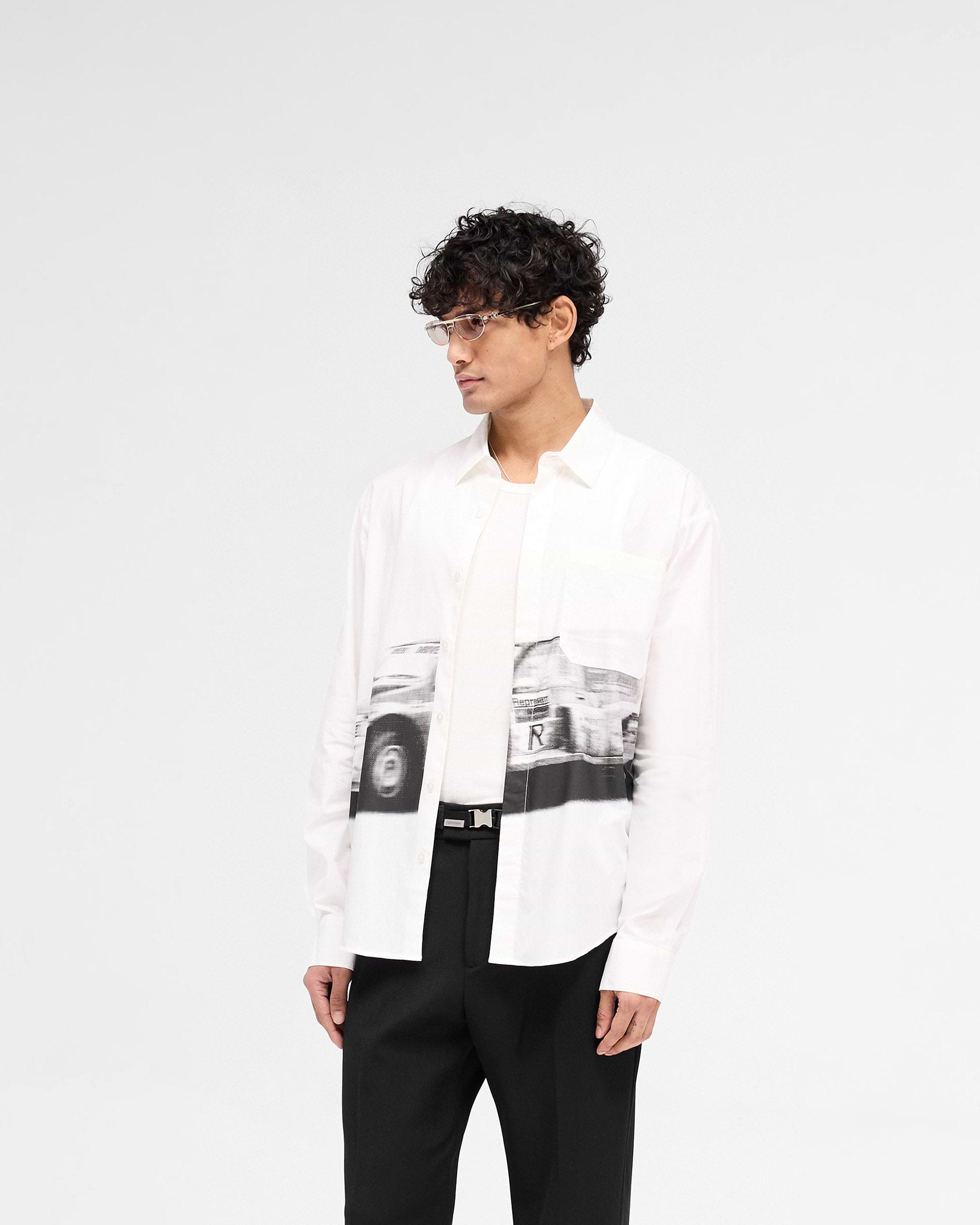 Back product image of a mens off white shirt on a plain white background | Raceway Shirt in Off White | Shirt with deep curved cuffs and raceway artwork | SS25 Shirts | Represent Clo