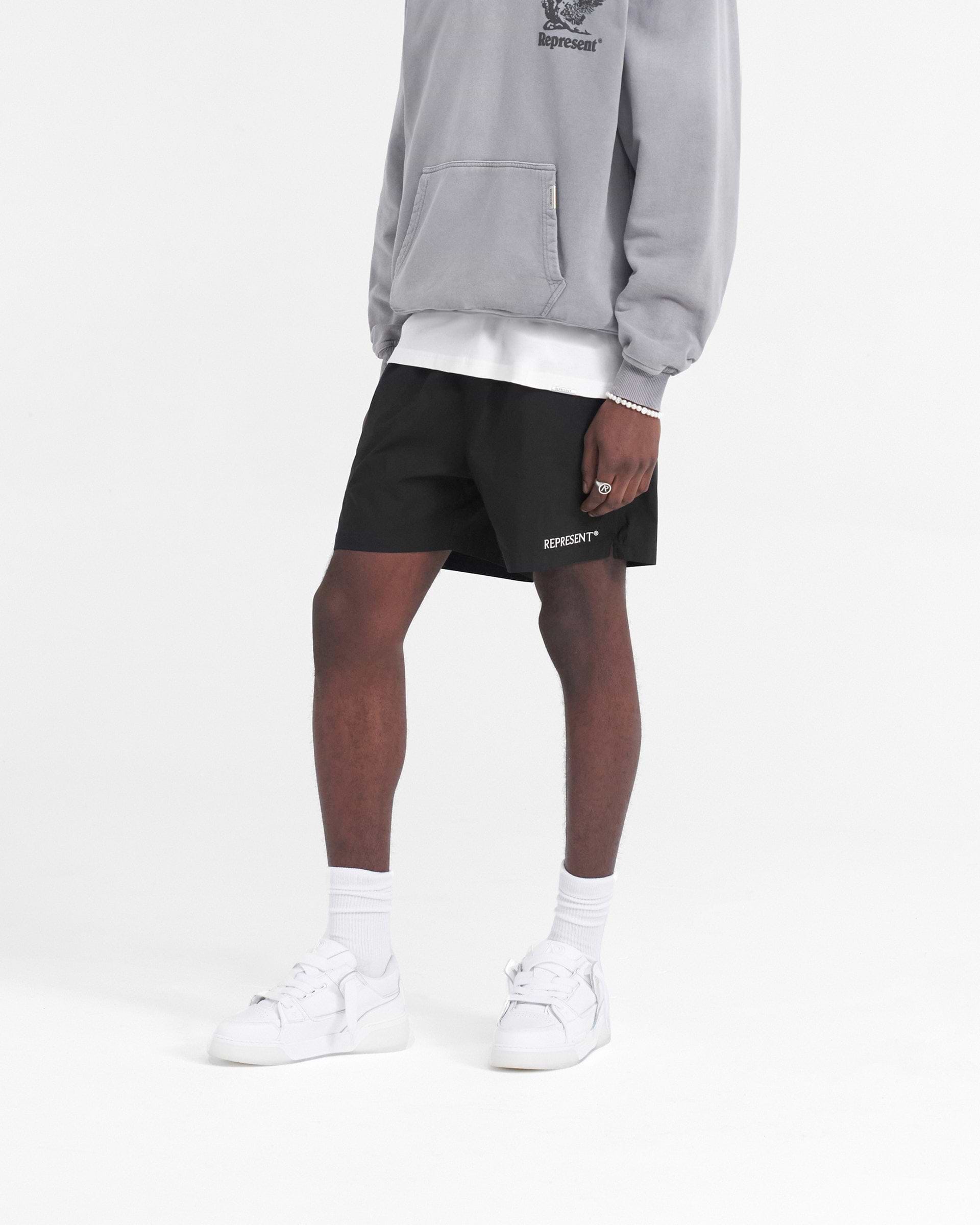 Back product image of mens black shorts on a plain white background | Represent Short in Black | Lightweight shorts with elasticated waistband | SS24 Shorts | Represent Clo
