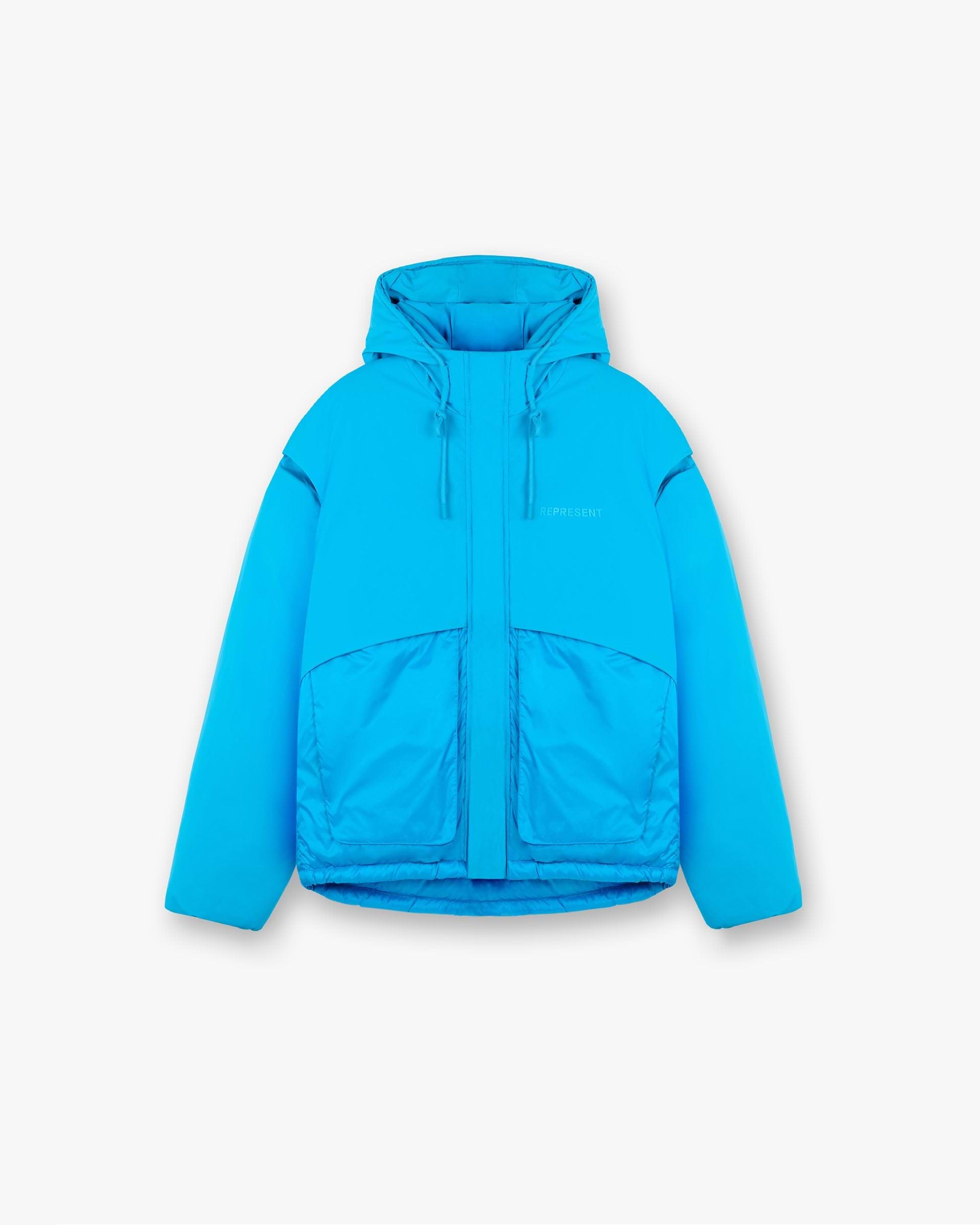 Front product image of a mens blue puffer jacket on a plain white background | Layered Hooded Puffer in Electric Blue | Hooded puffer jacket with layered design | FW24 Outerwear | Represent Clo