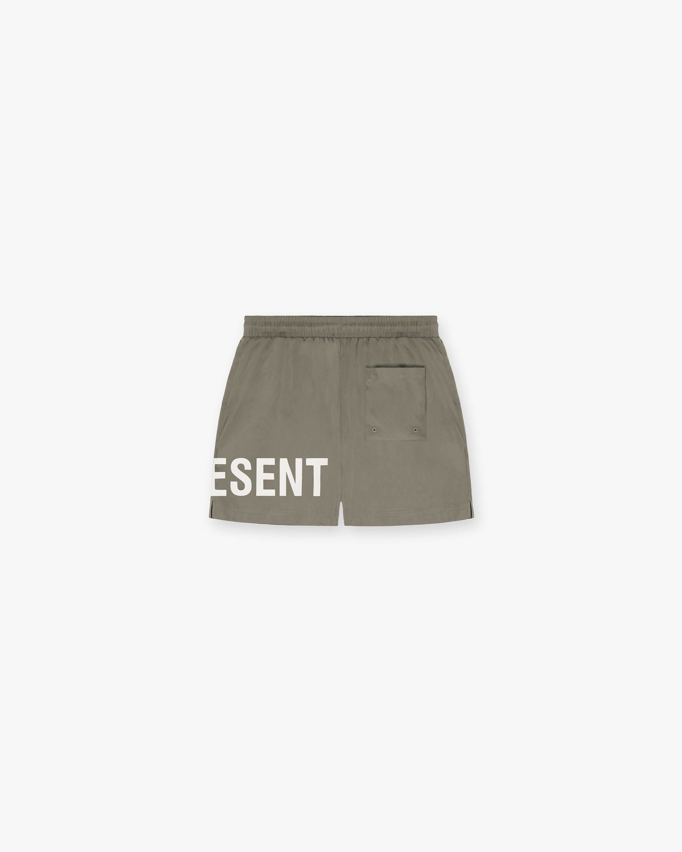 Back product image of mens khaki swim shorts on a plain white background | Swim Shorts in Khaki | Shorts with elasticated waistband and large logo print | SC23 Shorts | Represent Clo