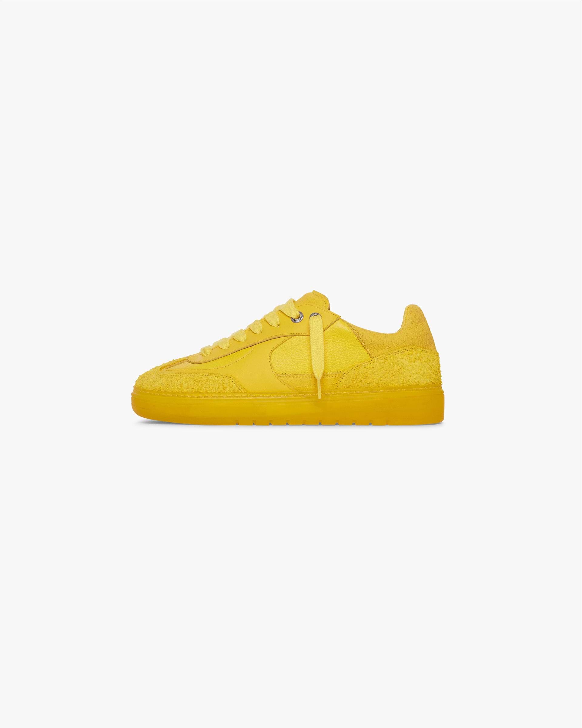 Product image of a mens yellow sneaker on a plain white background | Virtus in Yellow | Low profile sneaker with tri-leather and hairy suede upper | SS24 Footwear | Represent Clo