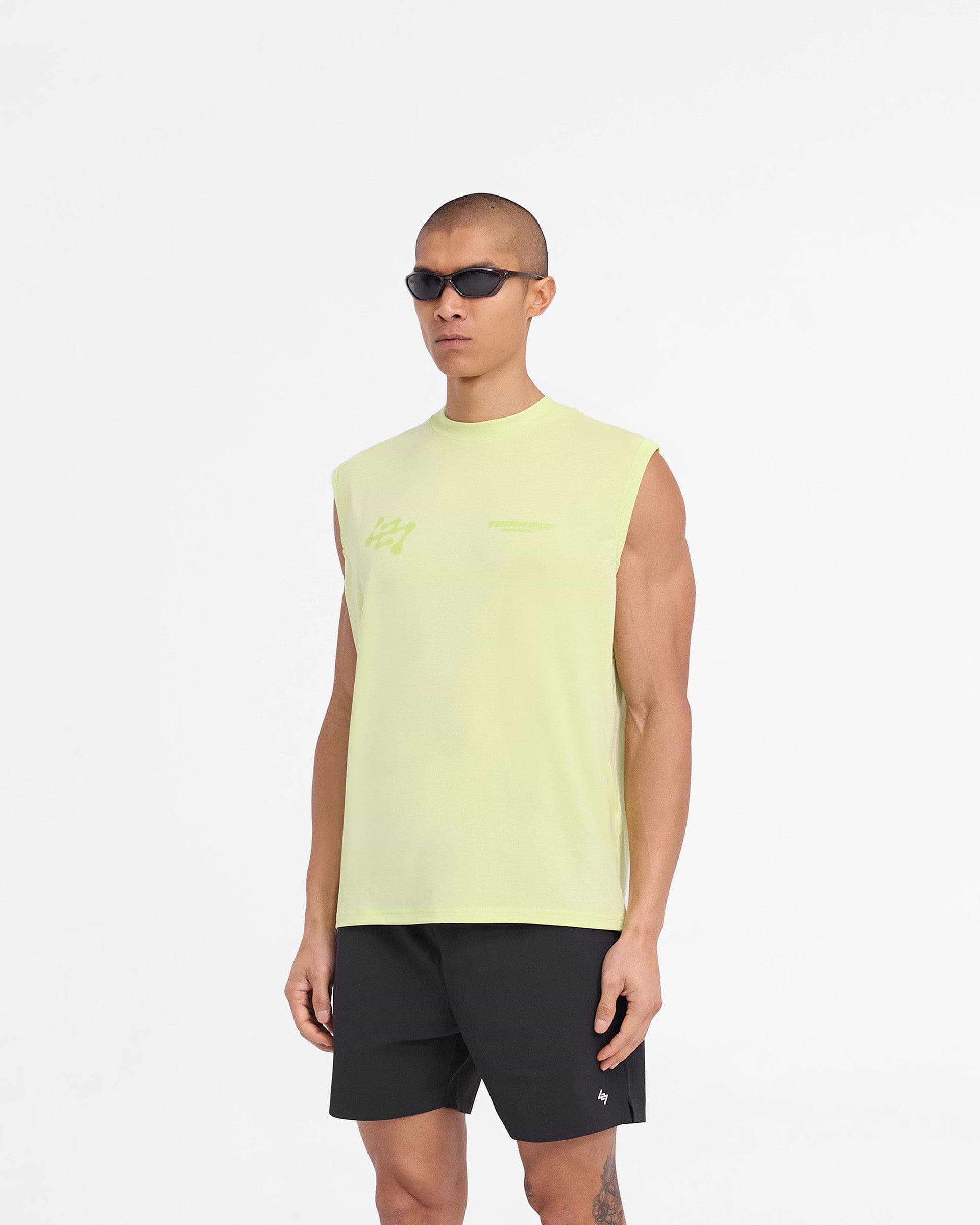 Man wearing a lime tank top on a plain white background | 247 Future Terrains Oversized Tank in Shadow Lime | Lightweight training tank top | 247 T-Shirts | Represent Clo