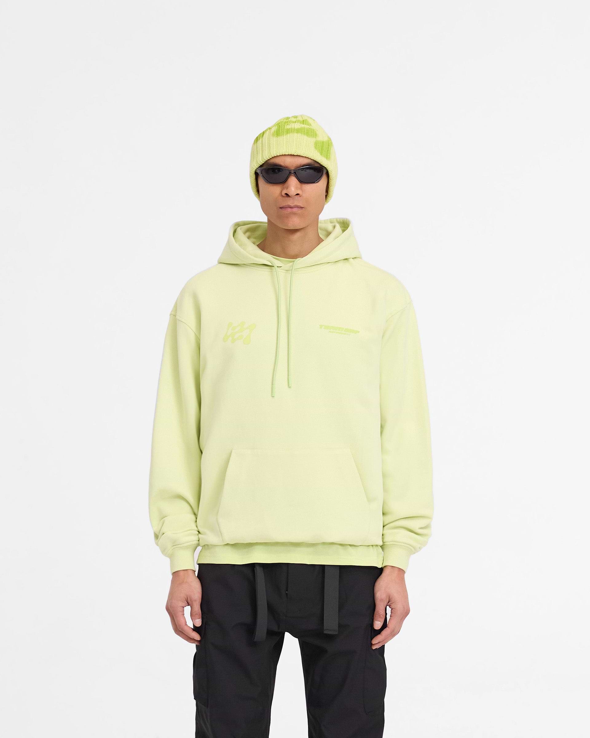 Man wearing an oversized lime hoodie on a plain white background | 247 Future Terrains Oversized Hoodie in Shadow Lime | Heavyweight cotton hoodie with tonal branding | 247 Hoodies | Represent Clo