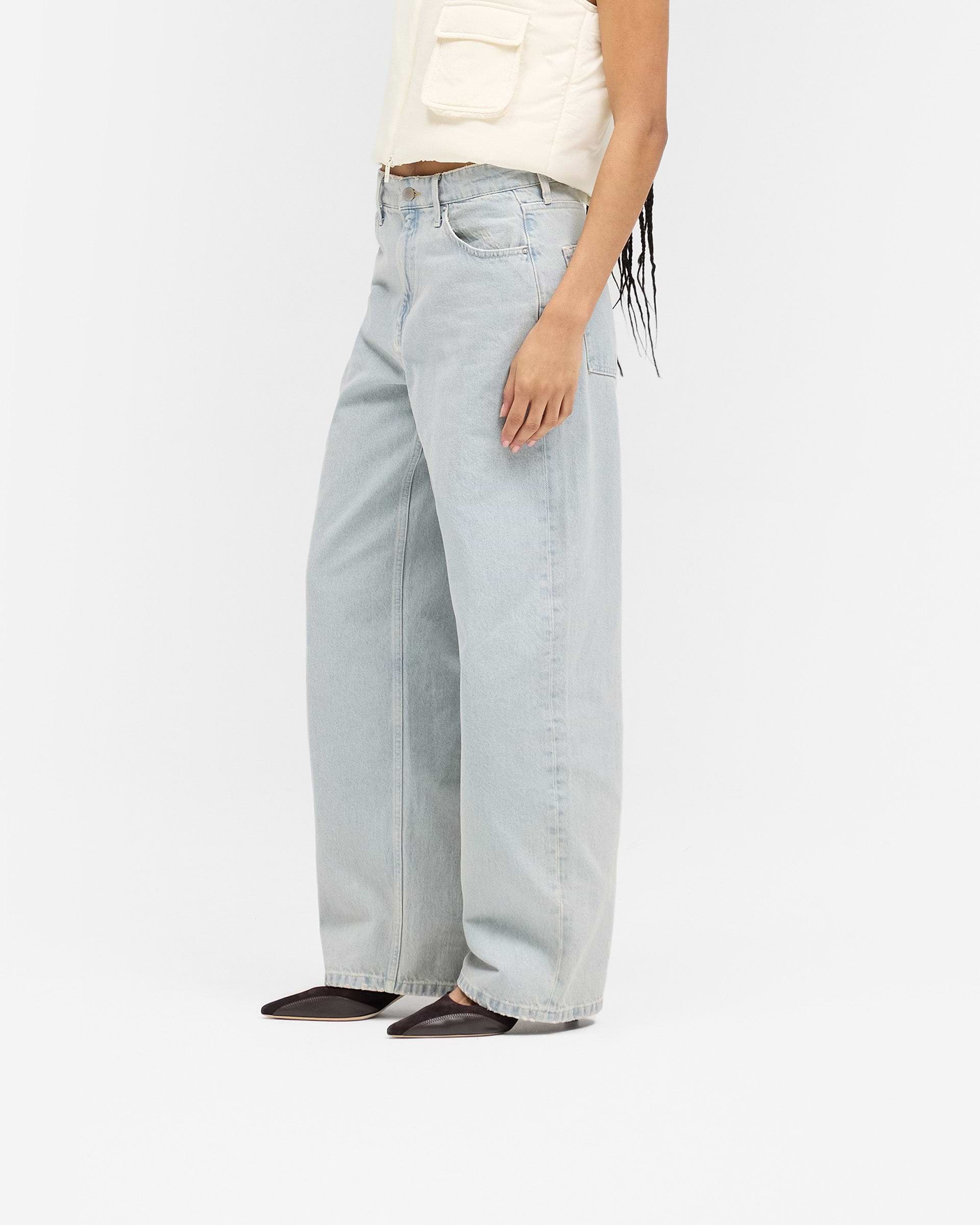 Back product image of womens blue jeans on a plain white background | Balloon Leg Jean in Ash Blue | Mid rise jeans with balloon leg and leather branded patch | SS25 Jeans | Represent Clo