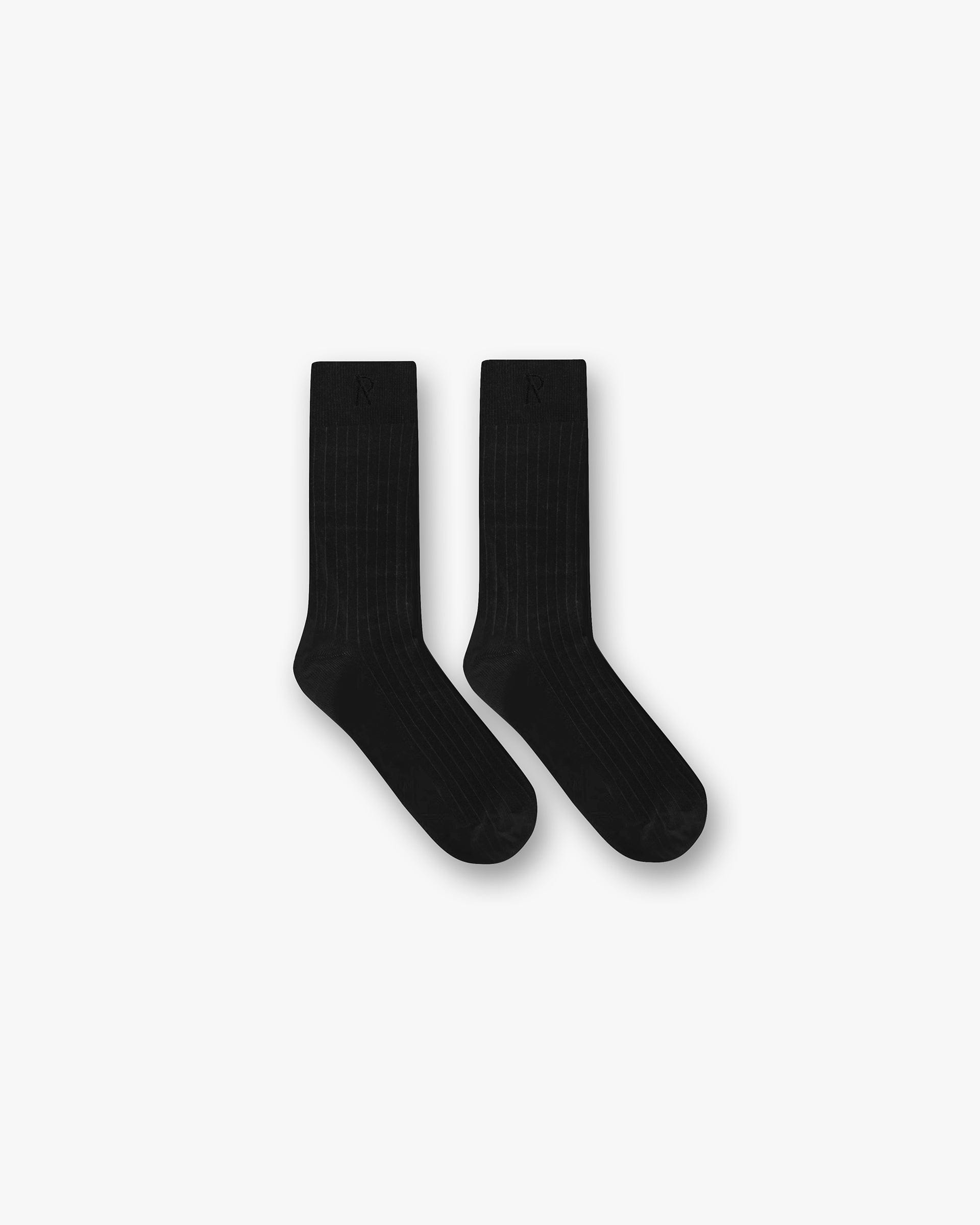 Front product image of mens black socks on a plain white background | Initial Socks in Black | Luxury socks | Initial Accessories | Represent Clo