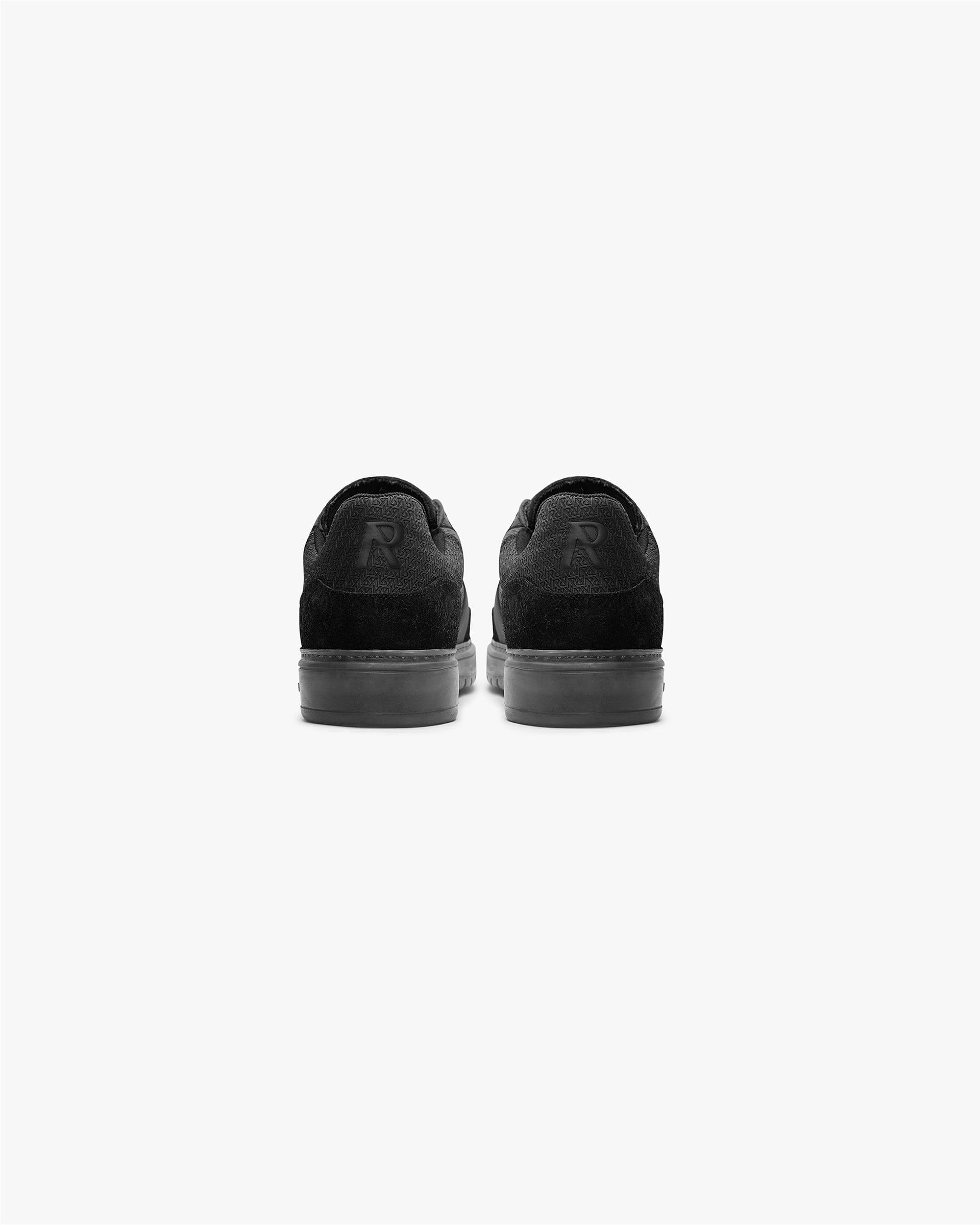 Minimalist mens black sneakers on a plain white background | Virtus in Off Black | Tri-leather sneaker with debossed logo details | FW23 Footwear | Represent Clo