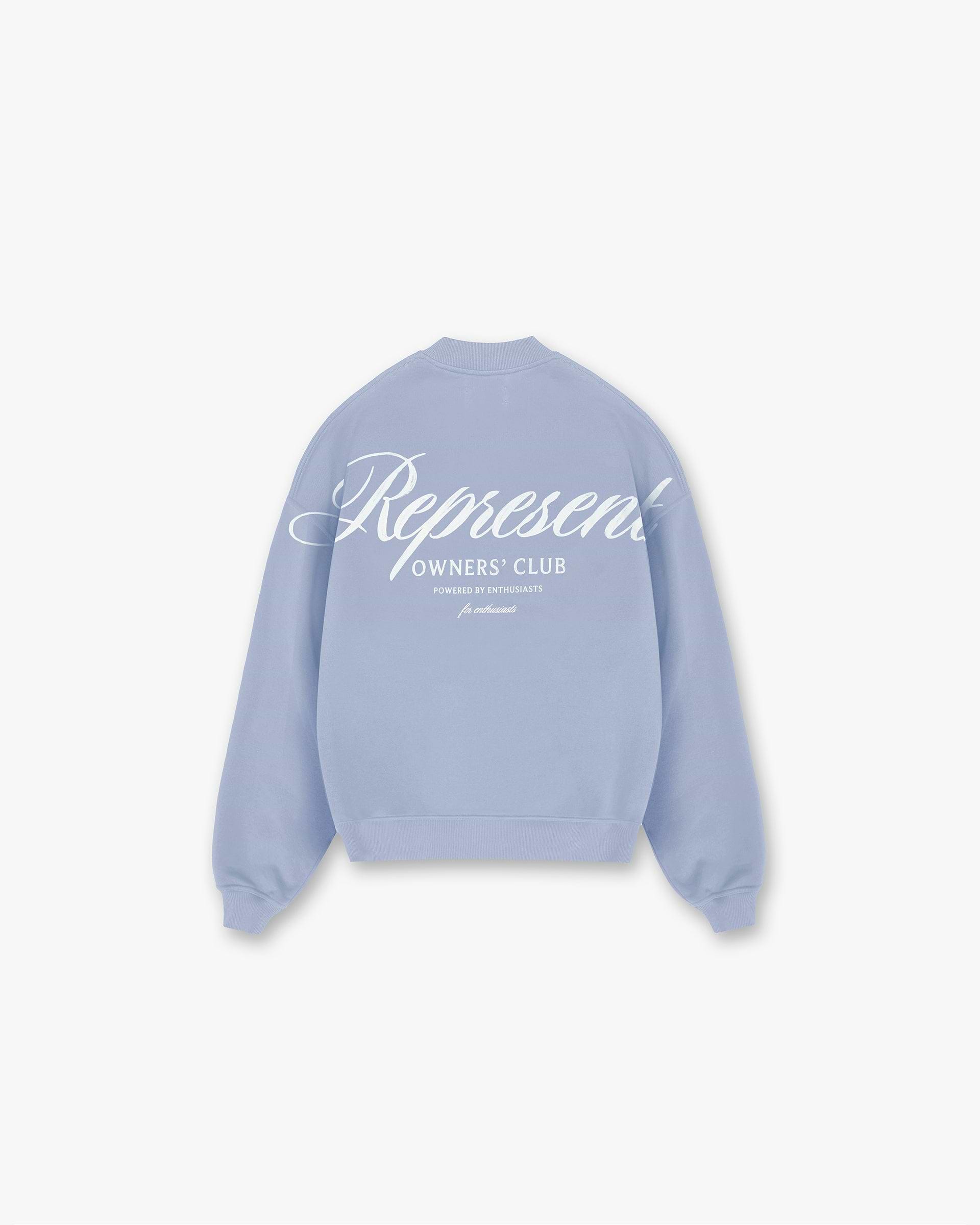 Back product image of a mens blue sweater on a plain white background | Represent Owners Club Script Sweater in Dusty Blue | Oversized fit sweater with ribbed hem and cuffs | Owners Club Sweaters | Represent Clo