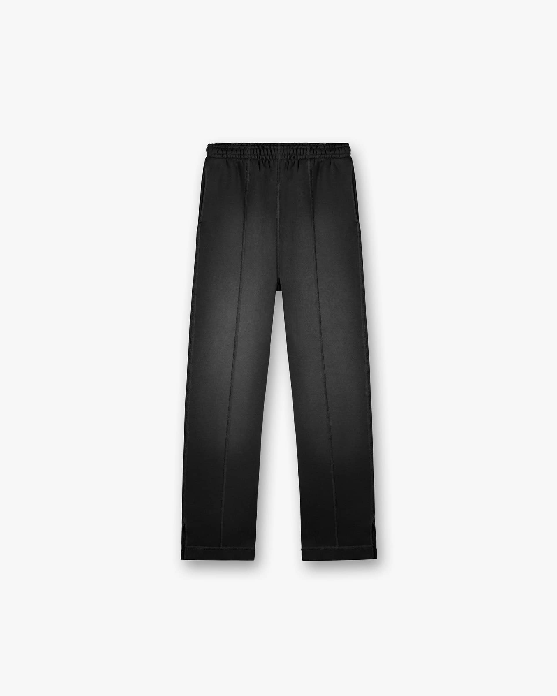 Front product image of mens black sweatpants on a plain white background | Stepped Hem Sweatpants in Stained Black | Sweatpants with stepped hem | FW24 Pants | Represent Clo