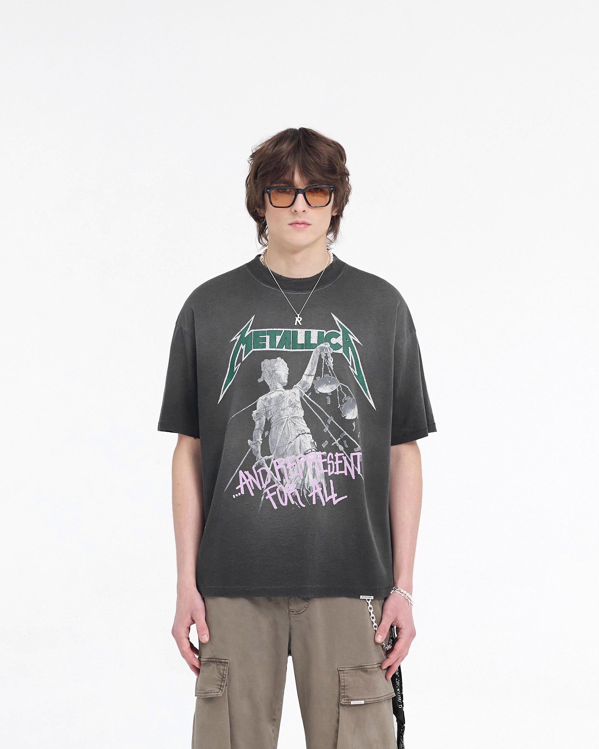 Man wearing a black t-shirt on a plain white background | Represent X Metallica Justice T-Shirt in Stained Black | Oversized fit Metallica graphic t-shirt | SS24 T-Shirts | Represent Clo