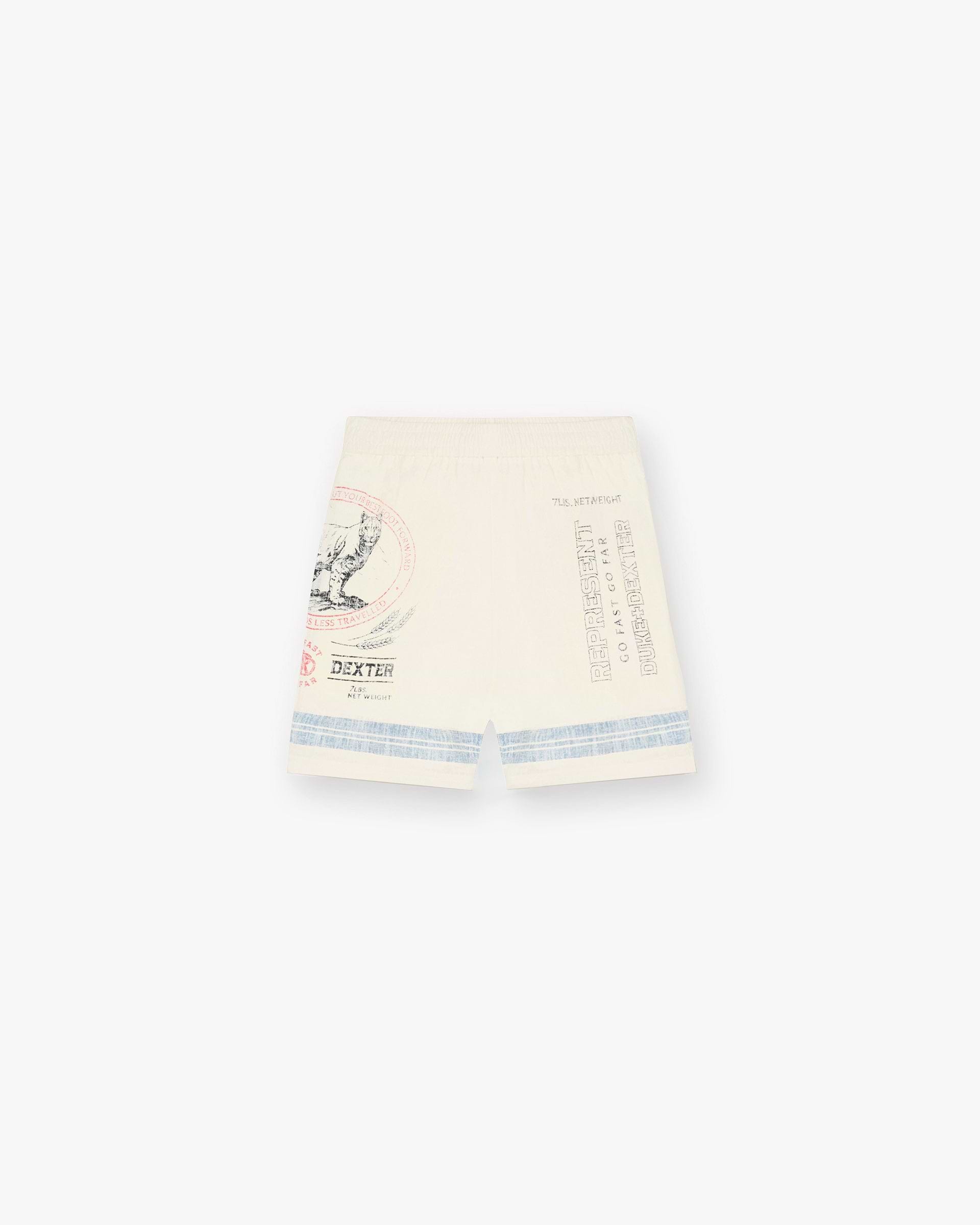 Front product image of mens ecru resort shorts on a plain white background | Represent X Duke + Dexter Mountain Lion Resort Short in Ecru | Luxury mens shorts | Exclusive Shorts | Represent Clo