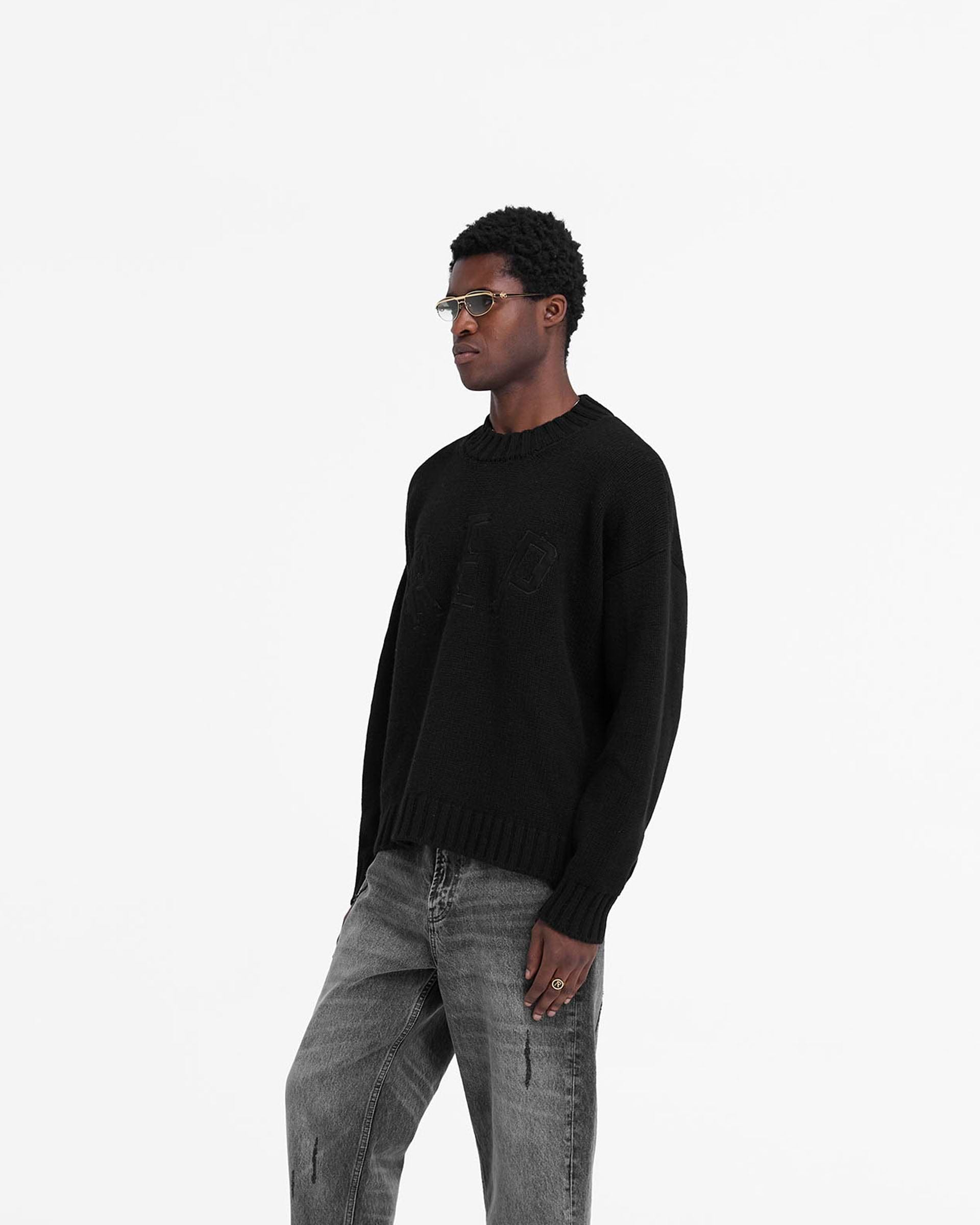 Back product image of a mens black knit jumper on a plain white background | Rep Knit Jumper in Black | Oversized knit jumper with ribbing | FW24 Knitwear | Represent Clo