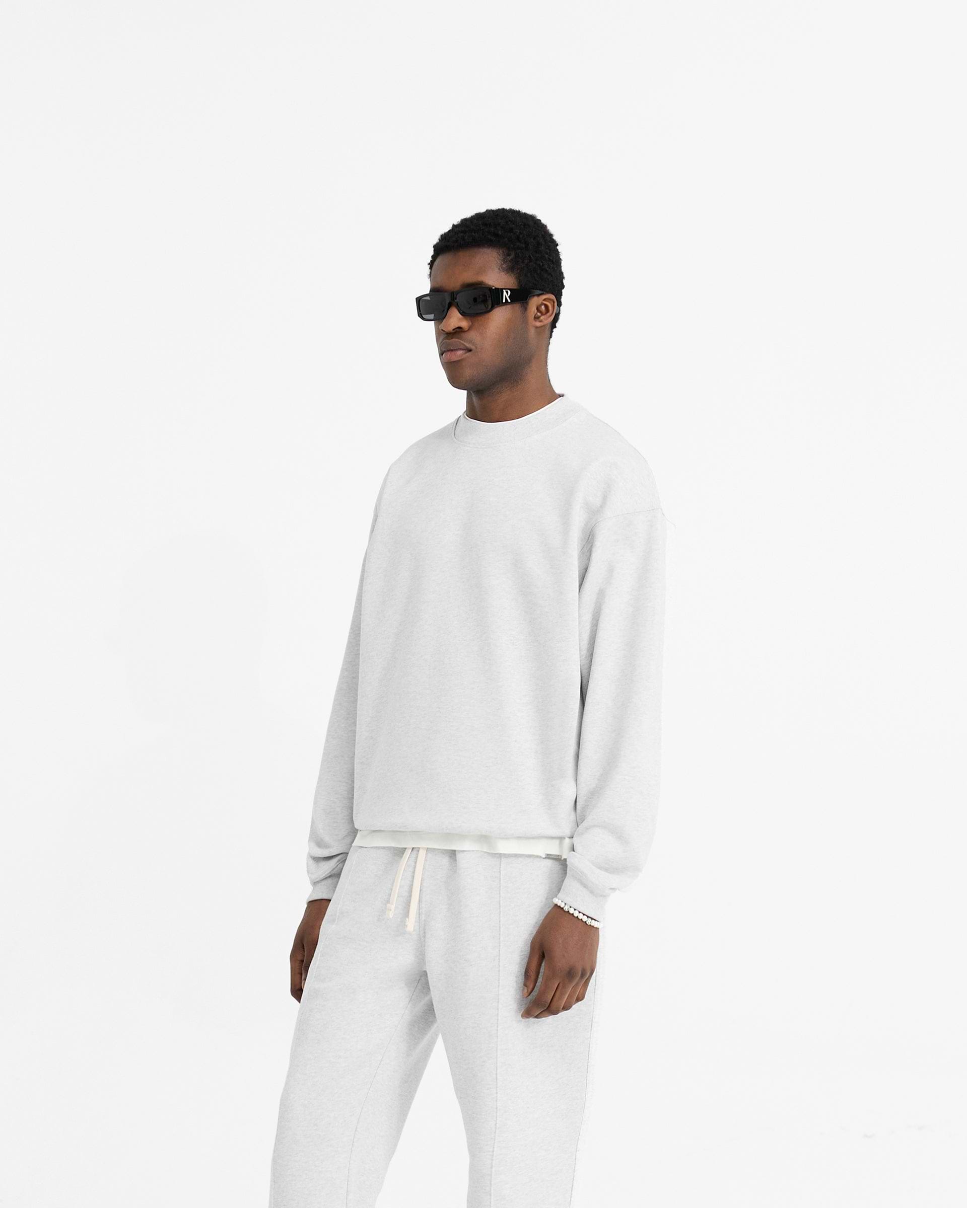 Back product image of a mens grey sweater on a plain white background | Initial Oversized Sweater in Ice Grey Marl | Oversized organic cotton sweater with embroidered details | Initial Sweaters | Represent Clo