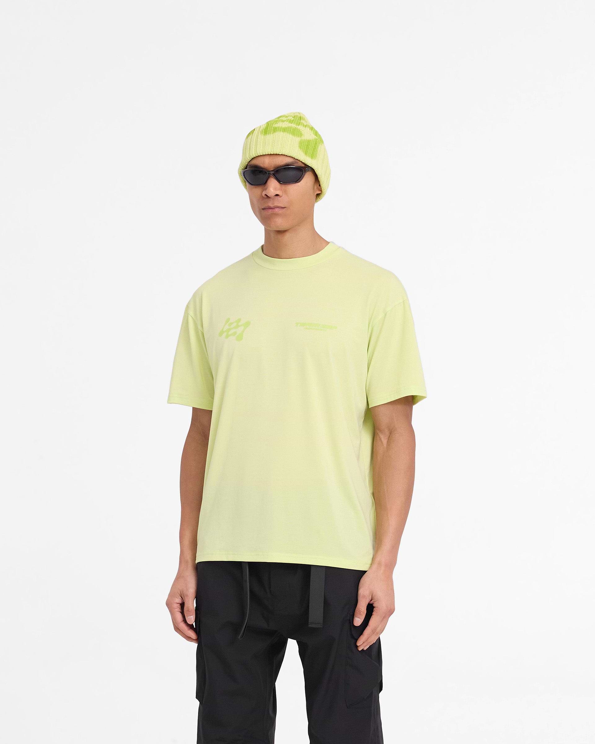 Man wearing an oversized lime t-shirt on a plain white background | 247 Future Terrains Oversized T-Shirt in Shadow Lime | Lightweight training t-shirt with quick drying fabric | 247 T-Shirts | Represent Clo