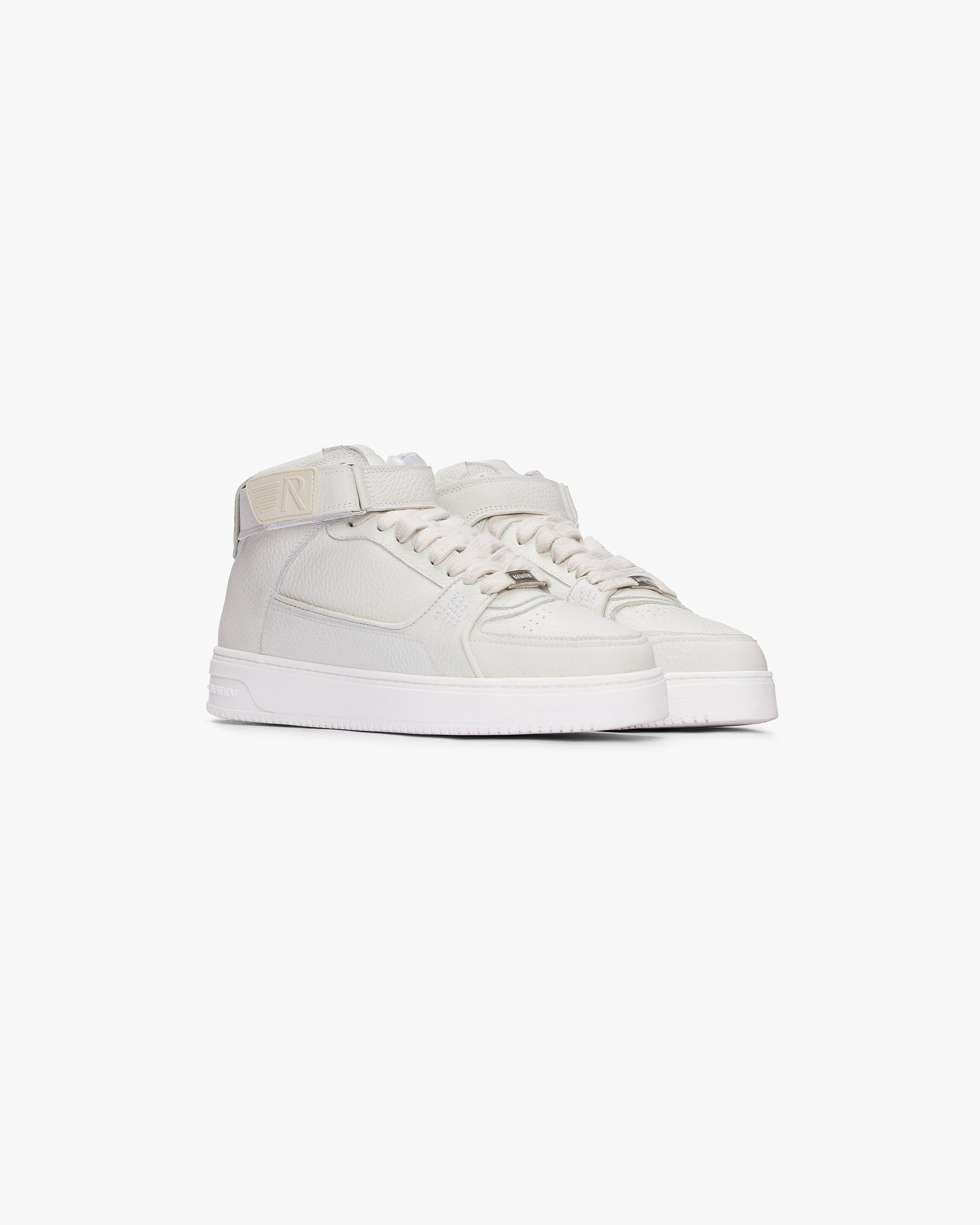 Back product image of a mens grey mid top sneaker on a plain white background | Apex Mid in Stone | Mid top sneakers with leather uppers and rubber outsole | FW22 Footwear | Represent Clo