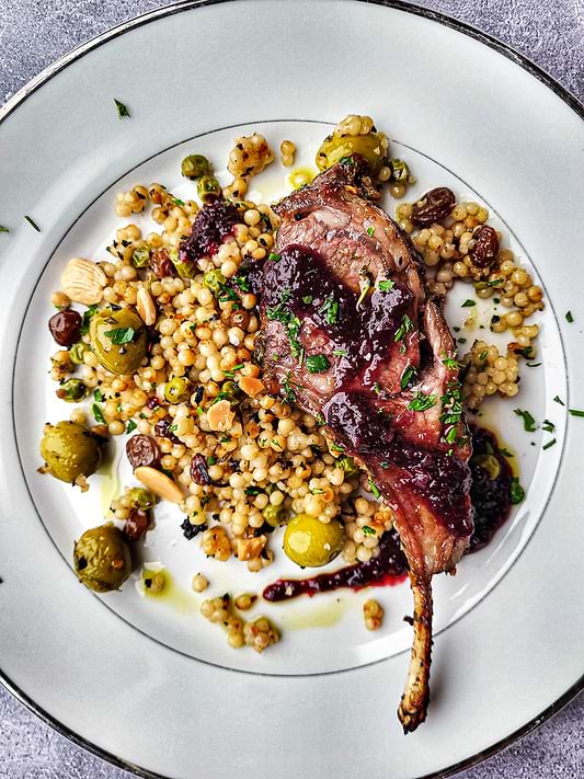 Lamb Chops with Red Wine Reduction, Garlic Confit, and Sauce Vierge